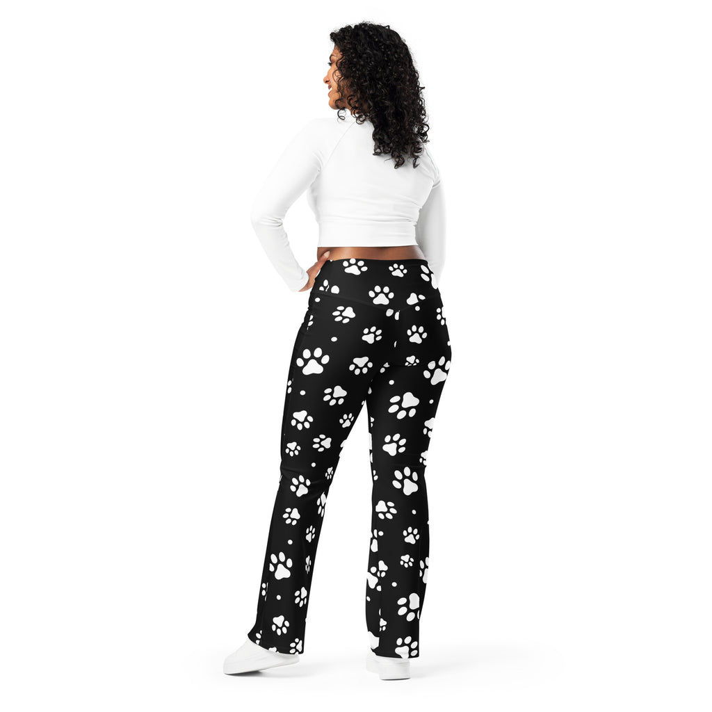 Women’s black high waist flare legging pants with playful white paw print pattern perfect for casual wear