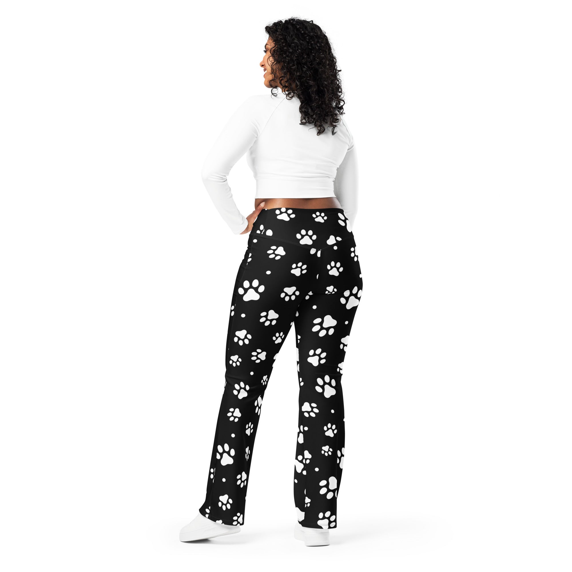 Women’s black high waist flare legging pants with playful white paw print pattern perfect for casual wear