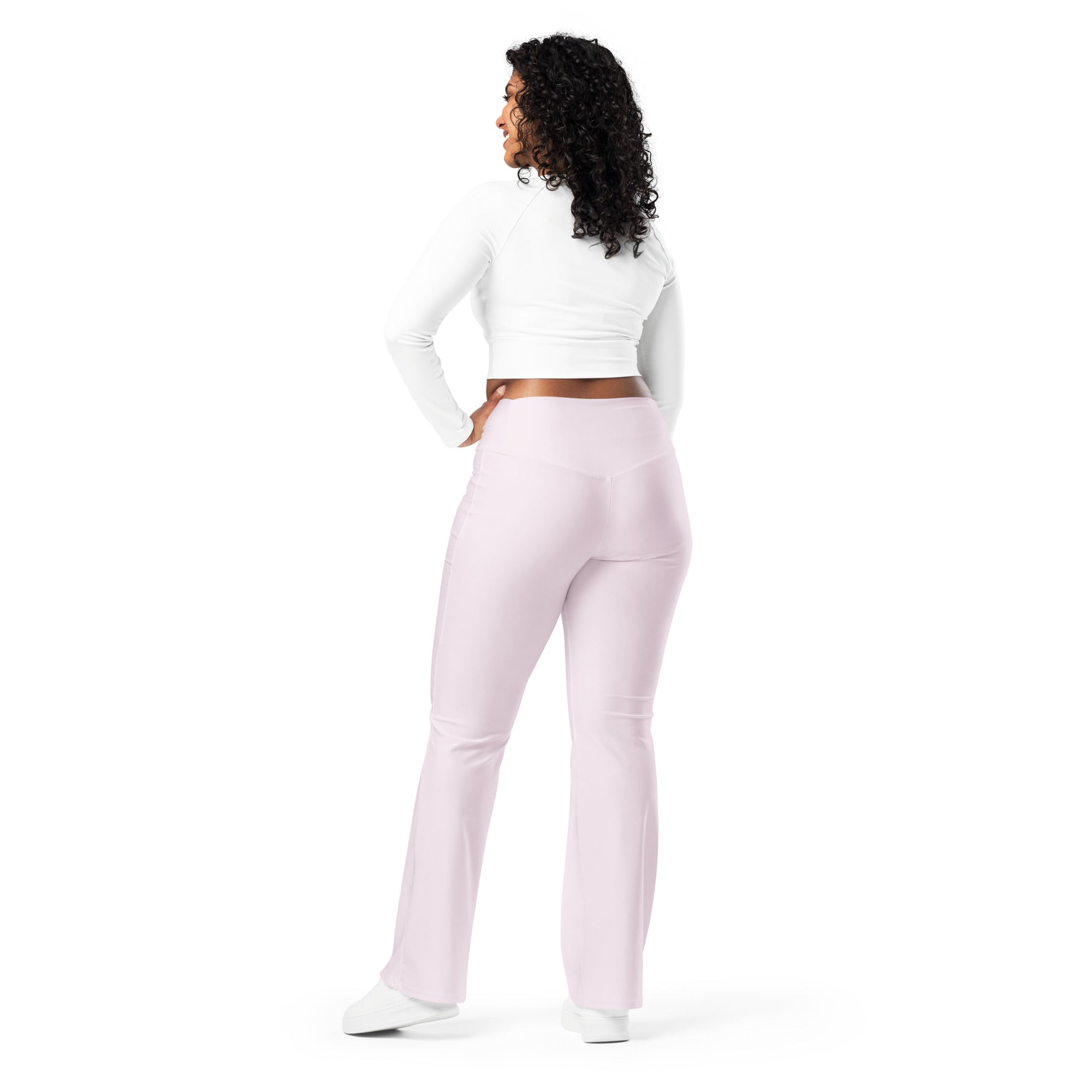 A pair of soft light pink high waist flare yoga pants designed for comfort and style during workouts