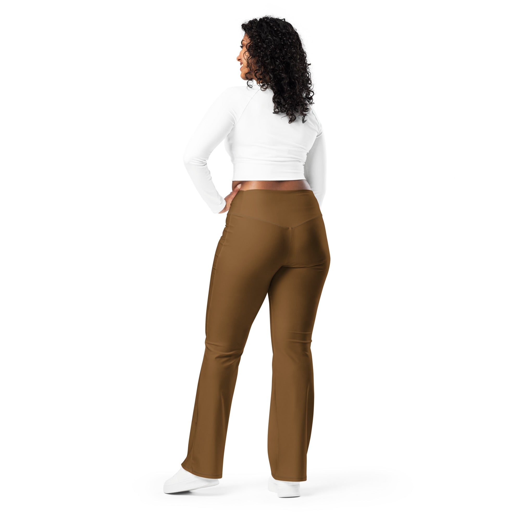 Women’s brown high waist flare legging pants made of smooth stretchy fabric shown from the back side