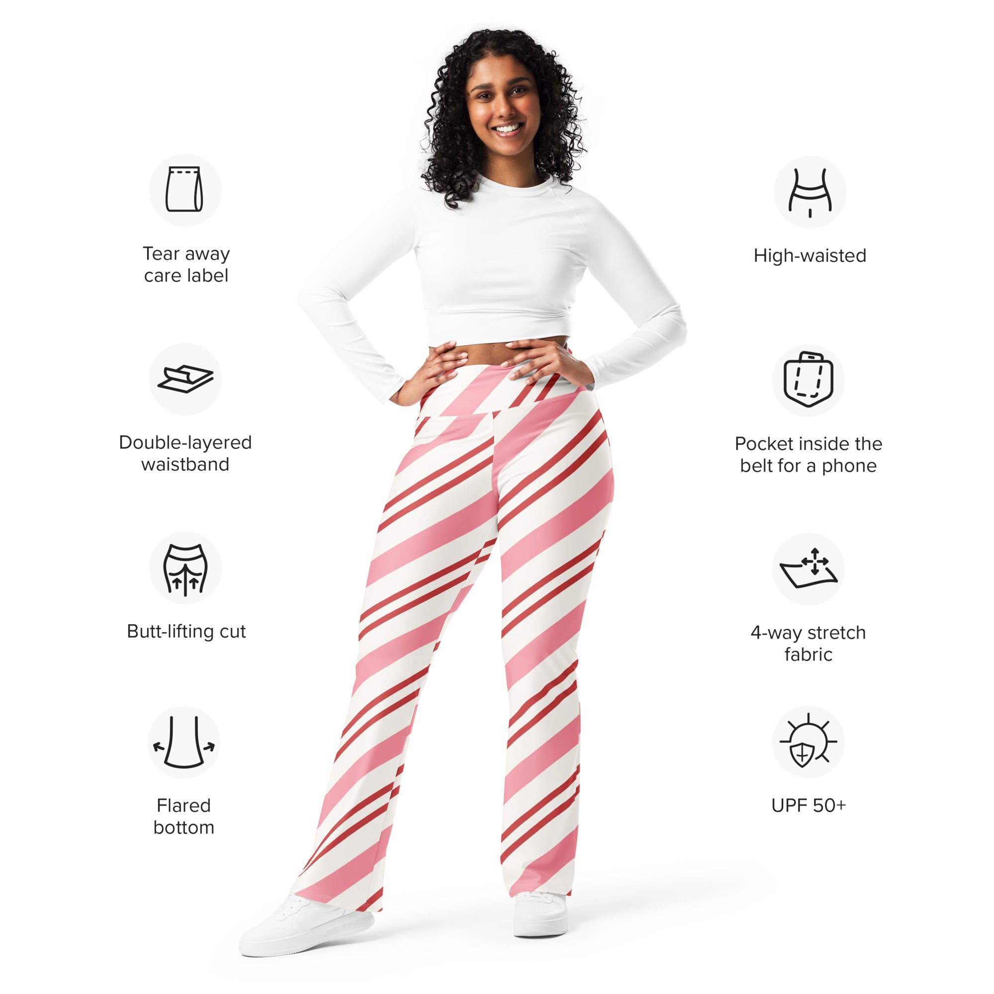 Women’s pink and white candy cane striped high waist flare legging pants with diagonal stripes and flared bottom