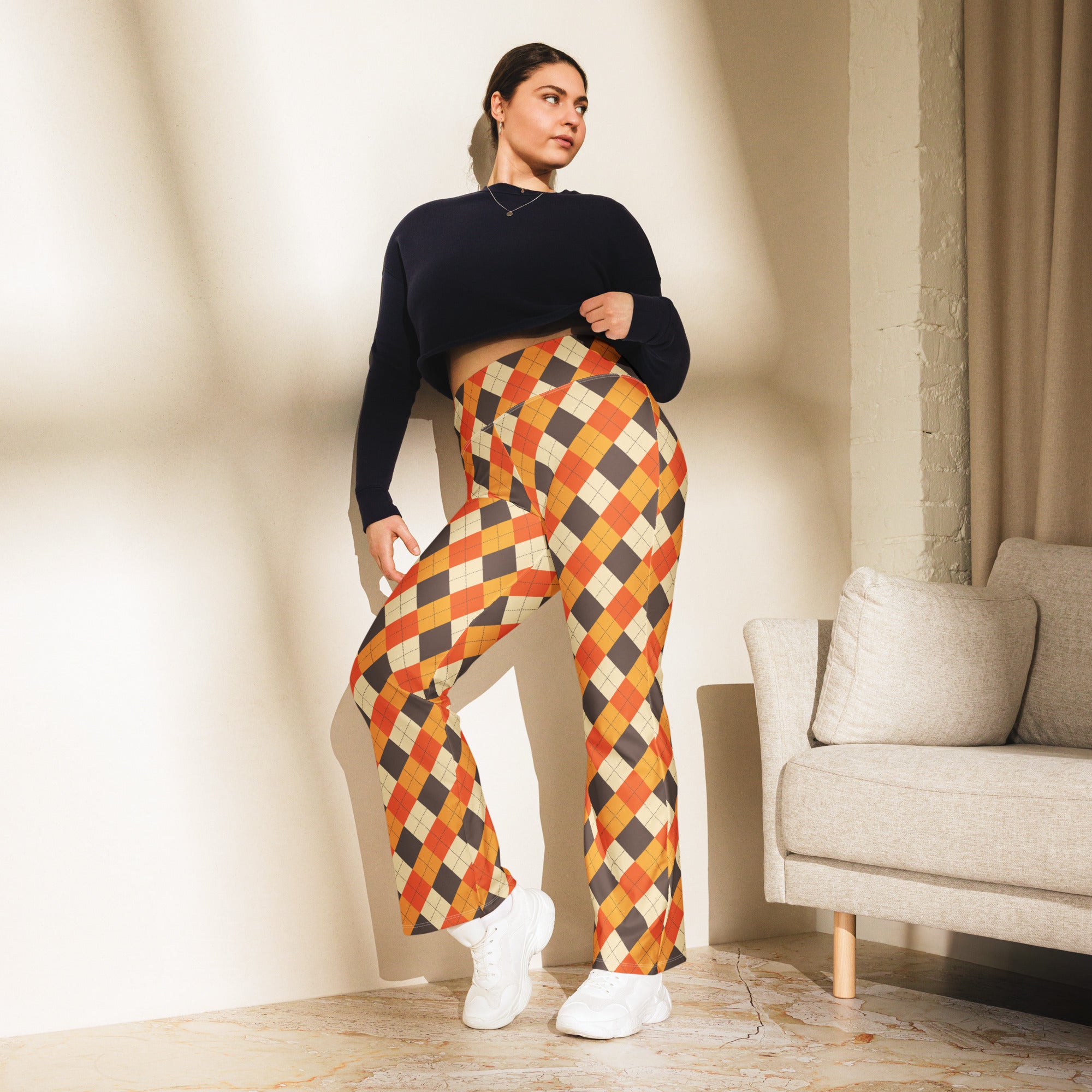 Women’s fall argyle high waist flare legging pants with bold orange black and cream argyle pattern