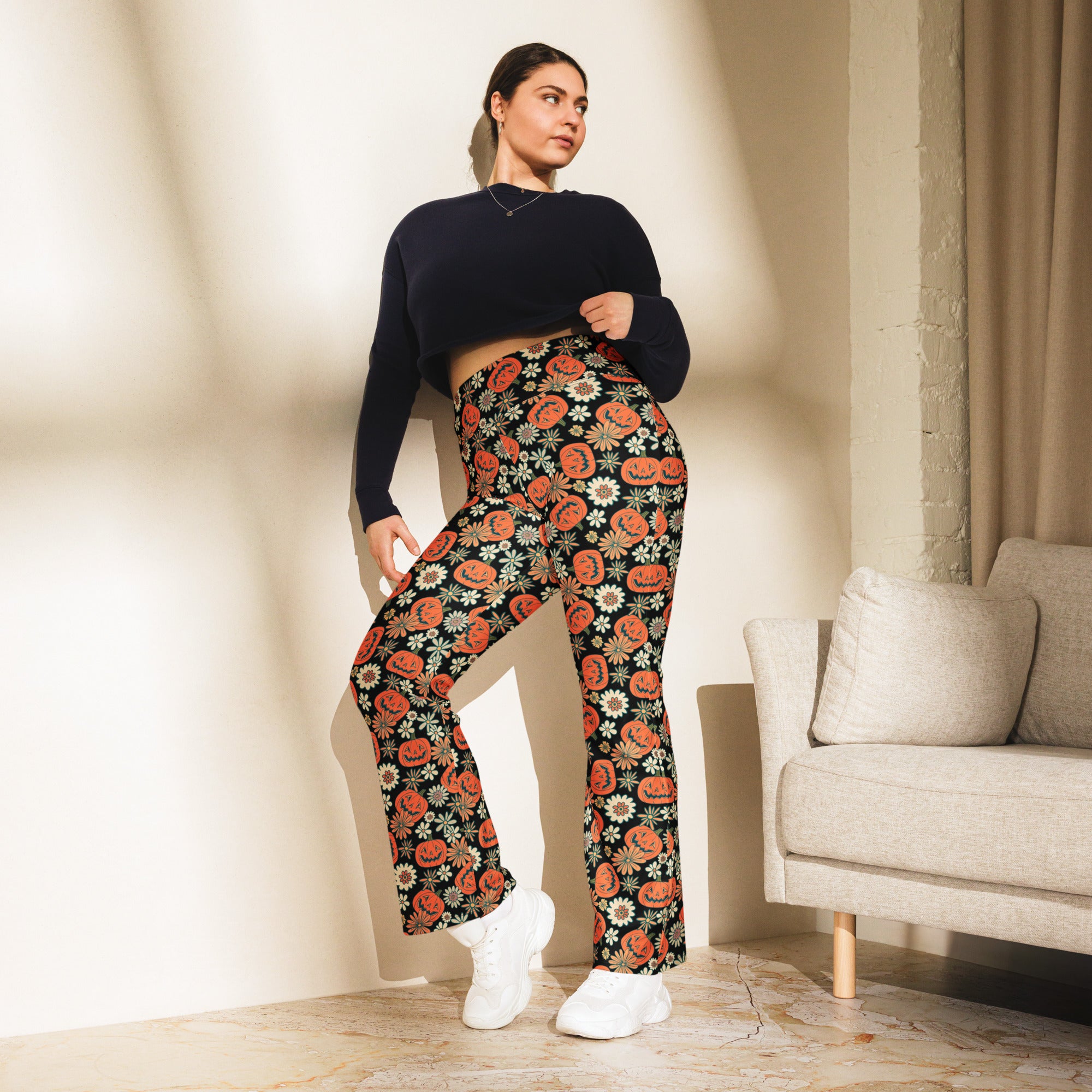 Women’s retro halloween high waist flare leggings in black with vibrant orange pumpkin and white flower pattern