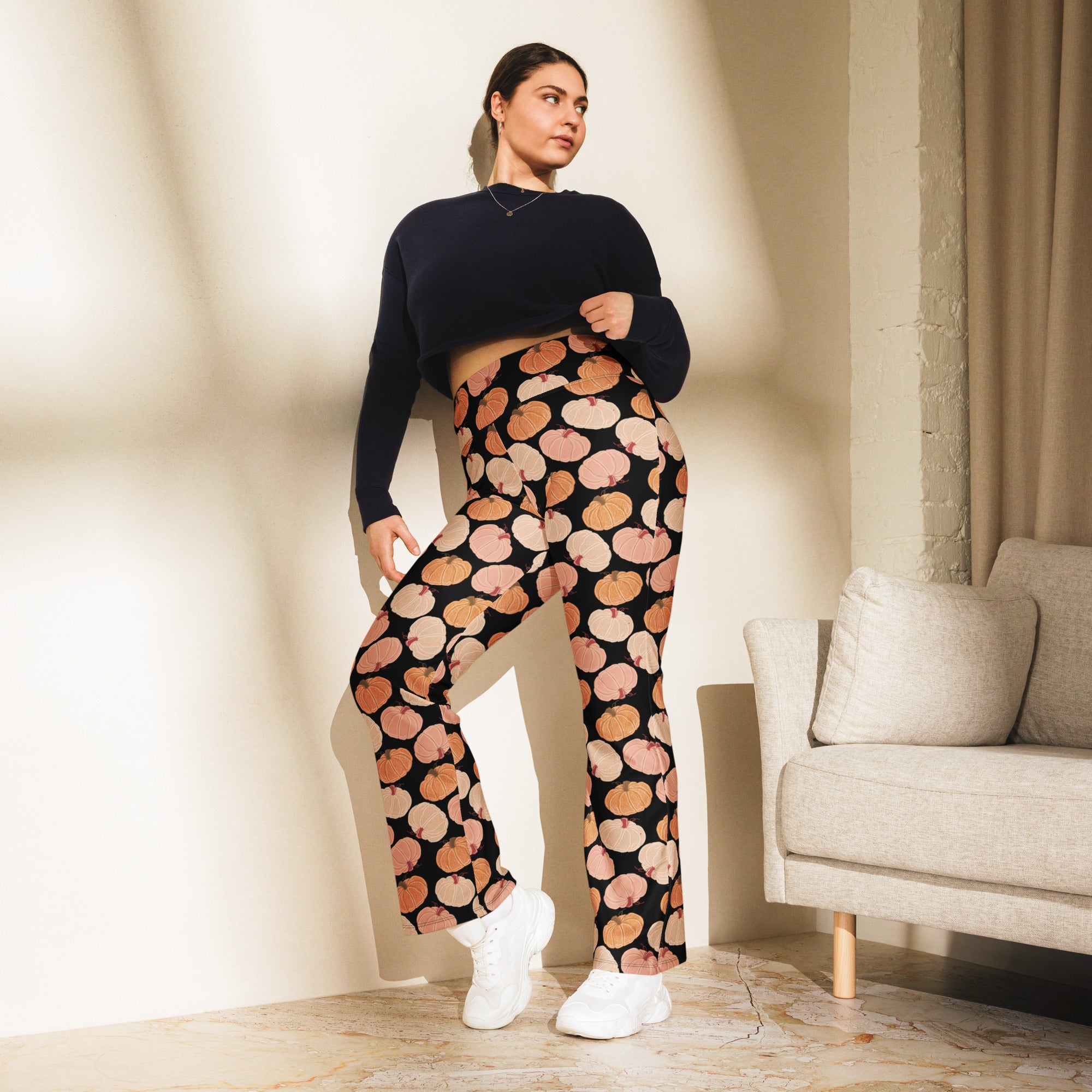 Women’s pumpkin patch high waist flare legging pants in black with orange and pink pumpkin pattern