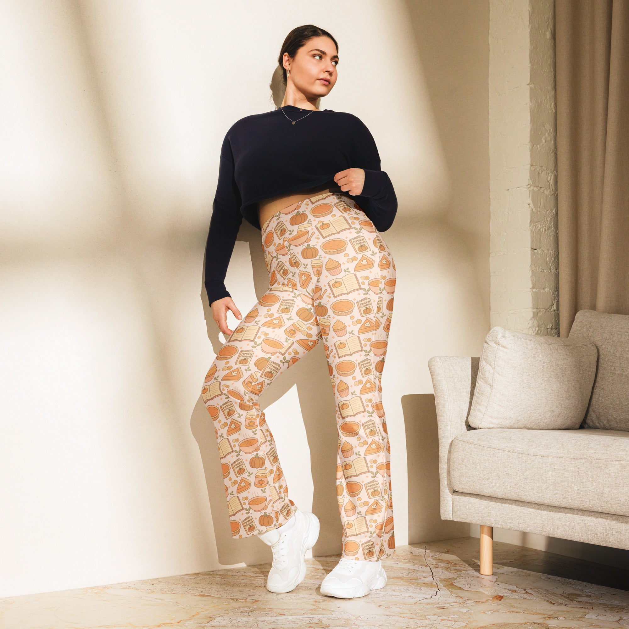 Women’s pumpkin pie themed high waist flare leggings in soft beige fabric with orange pumpkin pie and book prints