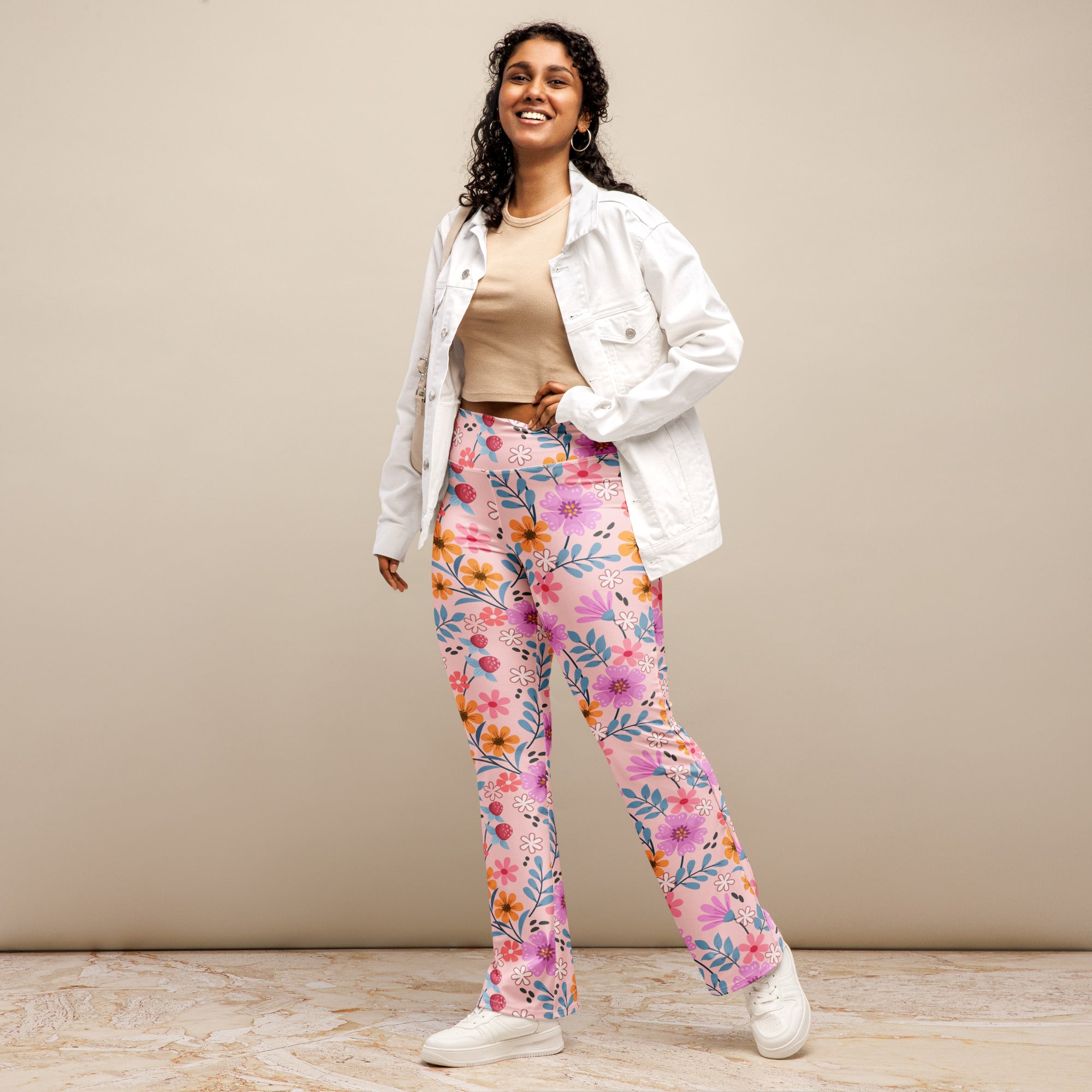 Women’s pink floral high waist flare legging pants with soft stretchy fabric and vibrant multicolored flowers