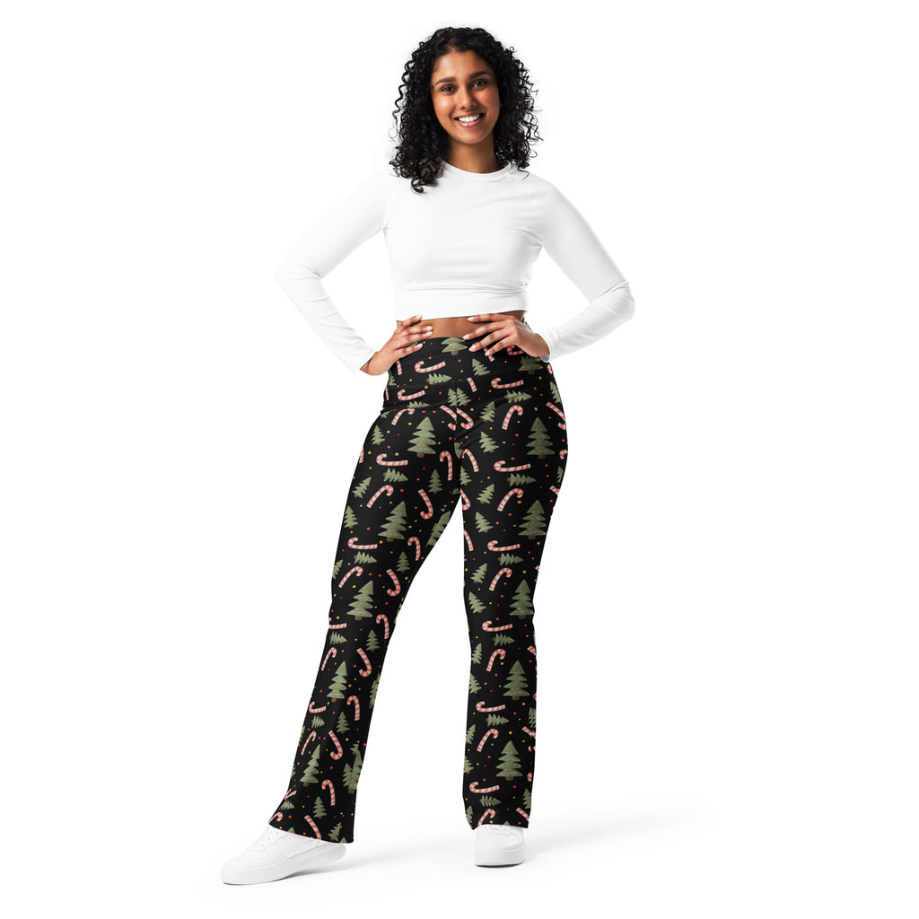 Women’s black christmas candy cane high waist flare leggings with pink candy canes and green pine trees pattern