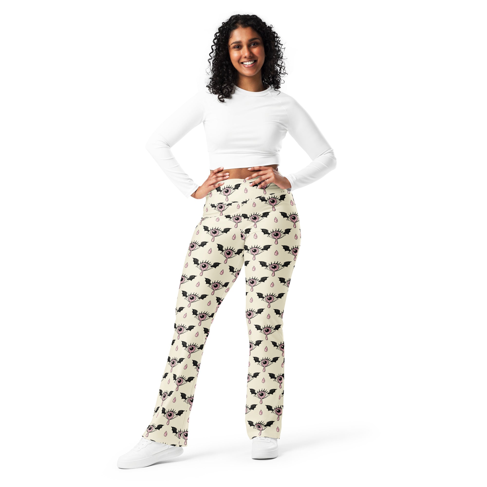 Cream-colored womens gothic eyeball bat high waist flare legging pants with black and pink winged cartoon eyes pattern