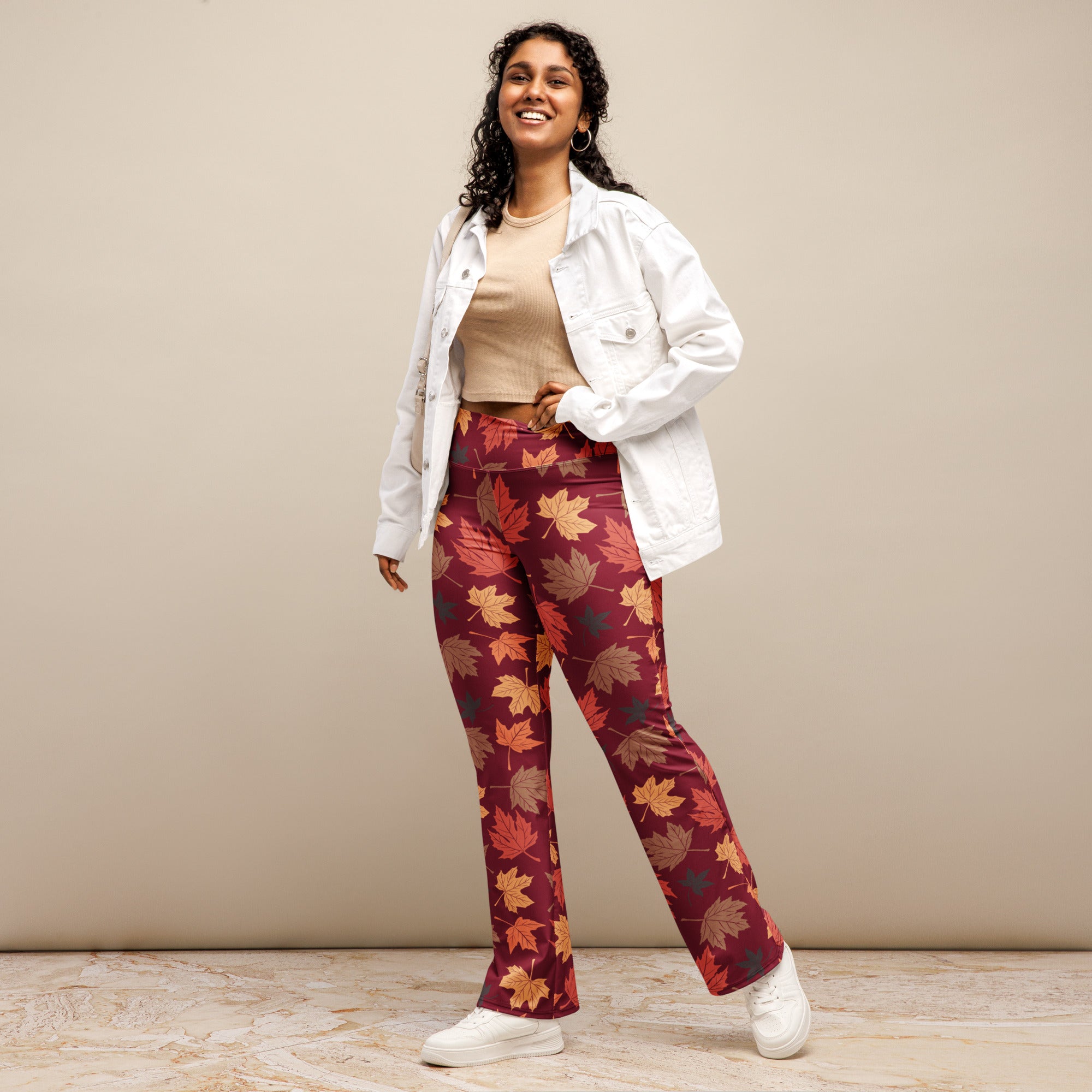 Women’s autumn leaves high waist flare legging pants in maroon with vibrant orange yellow and brown leaf pattern