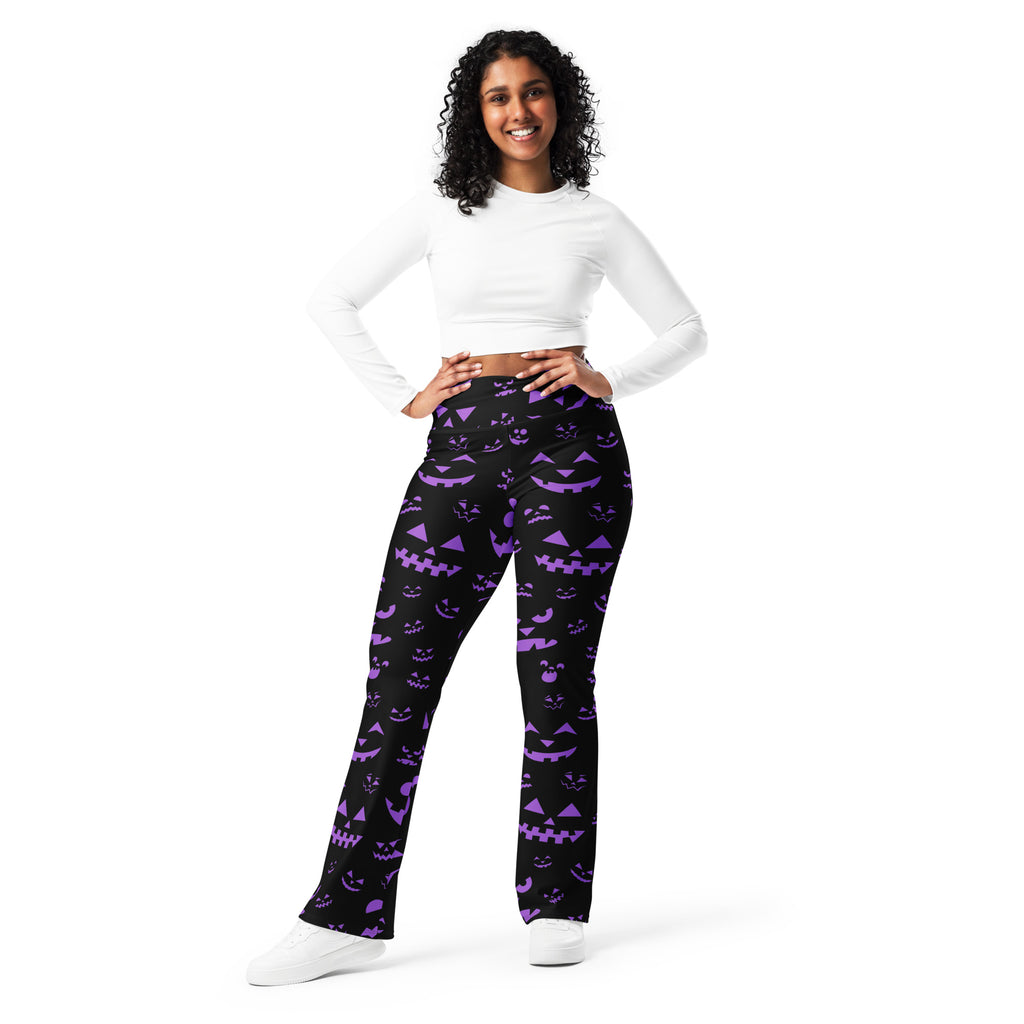 Women’s black high waist flare pants with vibrant purple jack o lantern halloween pattern