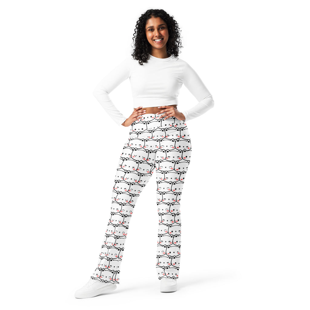 Women’s white high waist flare legging pants with playful black outlined cartoon cats and pink accents pattern