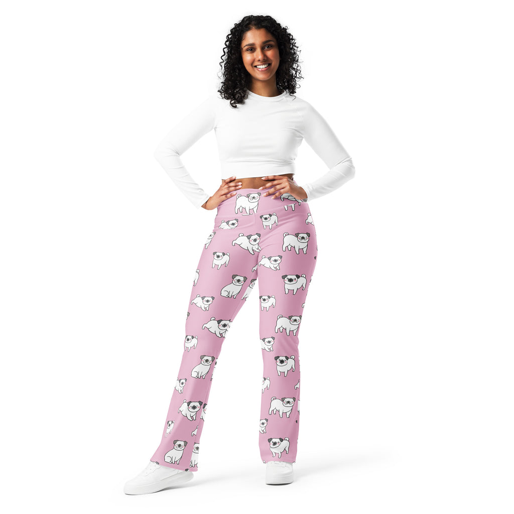 Women’s pink high waist flare leggings with playful white pug dog illustrations designed for casual wear