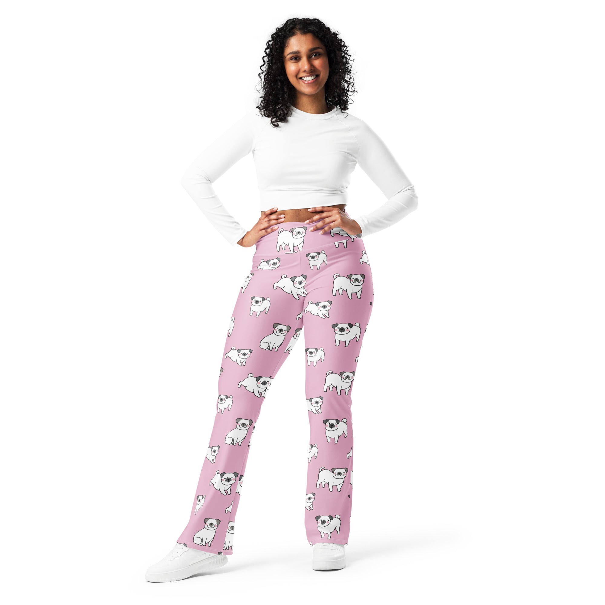 Women’s pink high waist flare leggings with playful white pug dog illustrations designed for casual wear