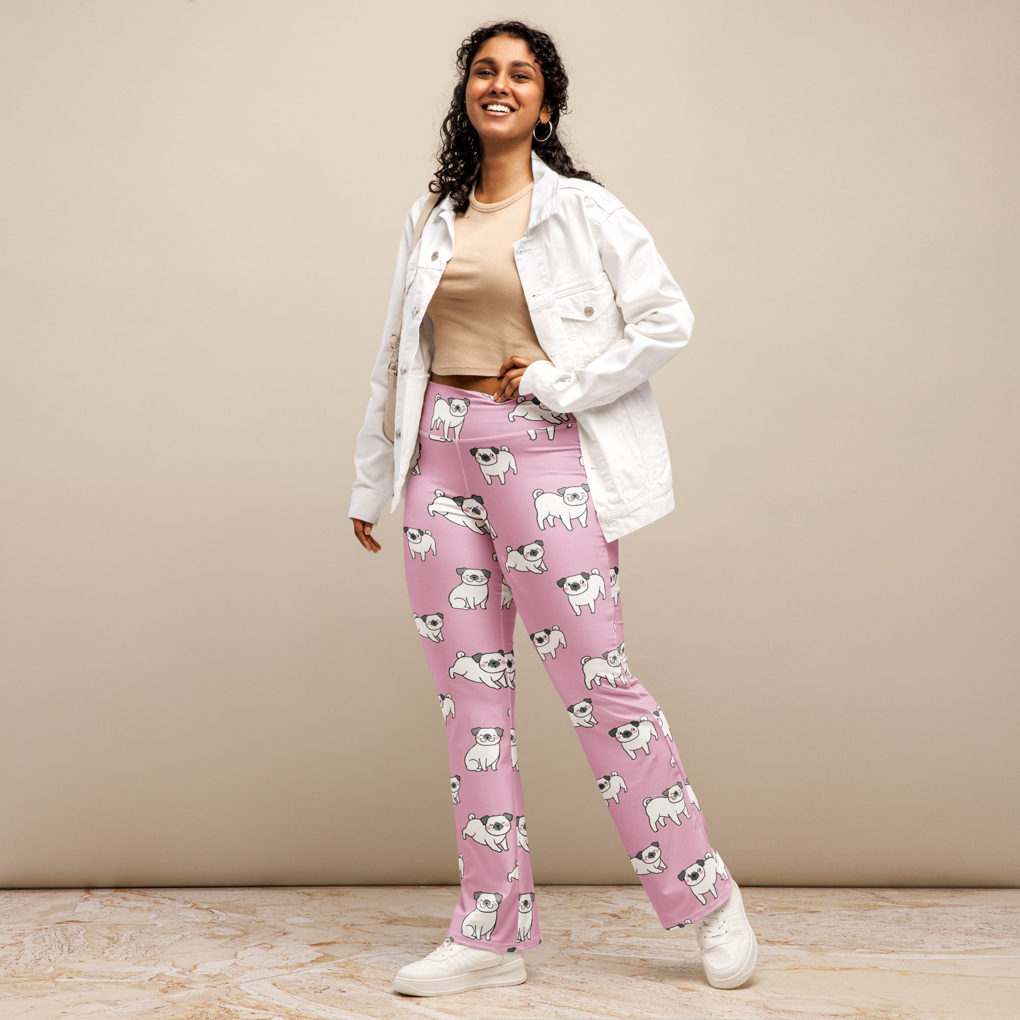 Women’s pink pug dog high waist flare legging pants with playful white pug illustrations all over the fabric