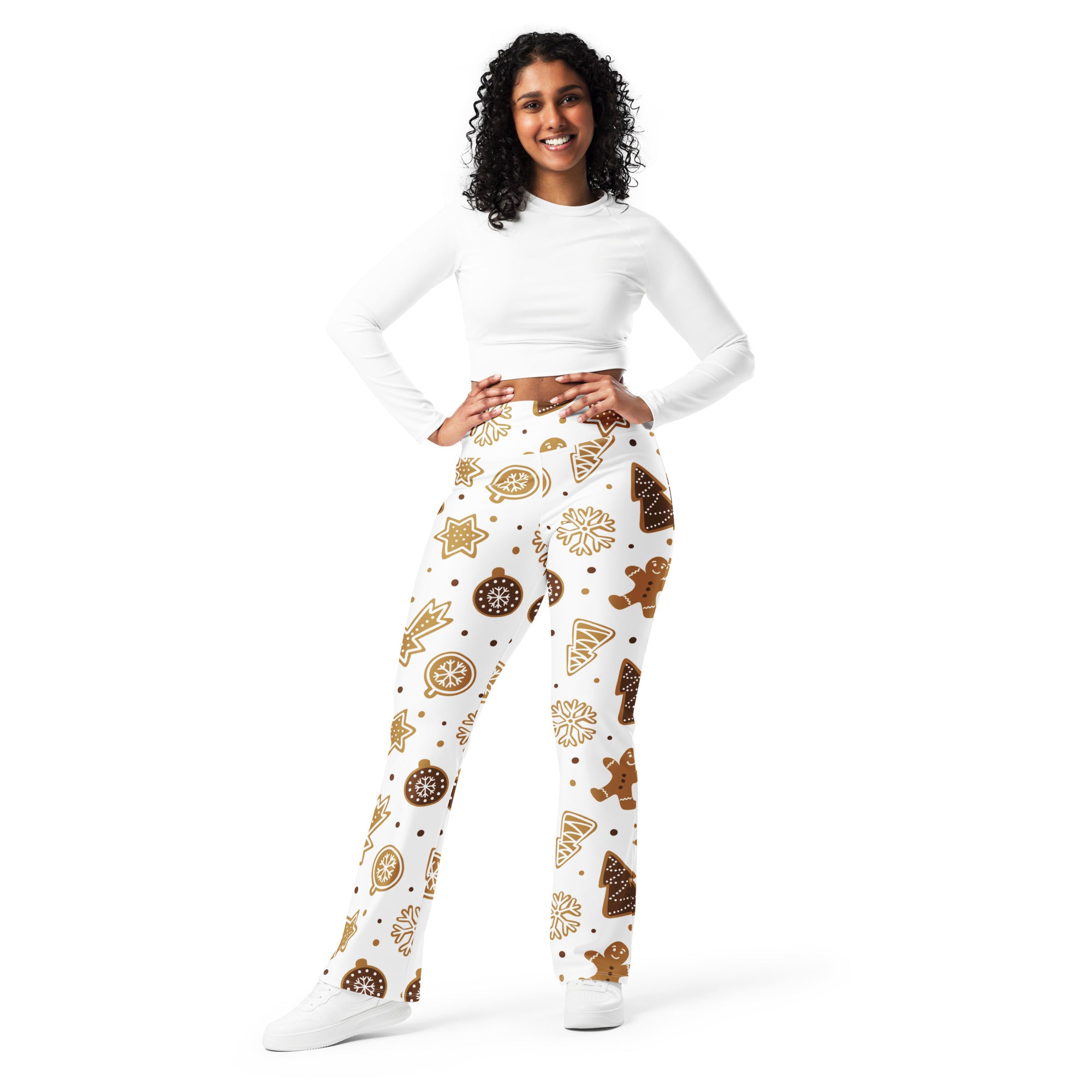 White women’s high waist flare leggings with festive brown and gold gingerbread cookies ornaments stars and trees pattern