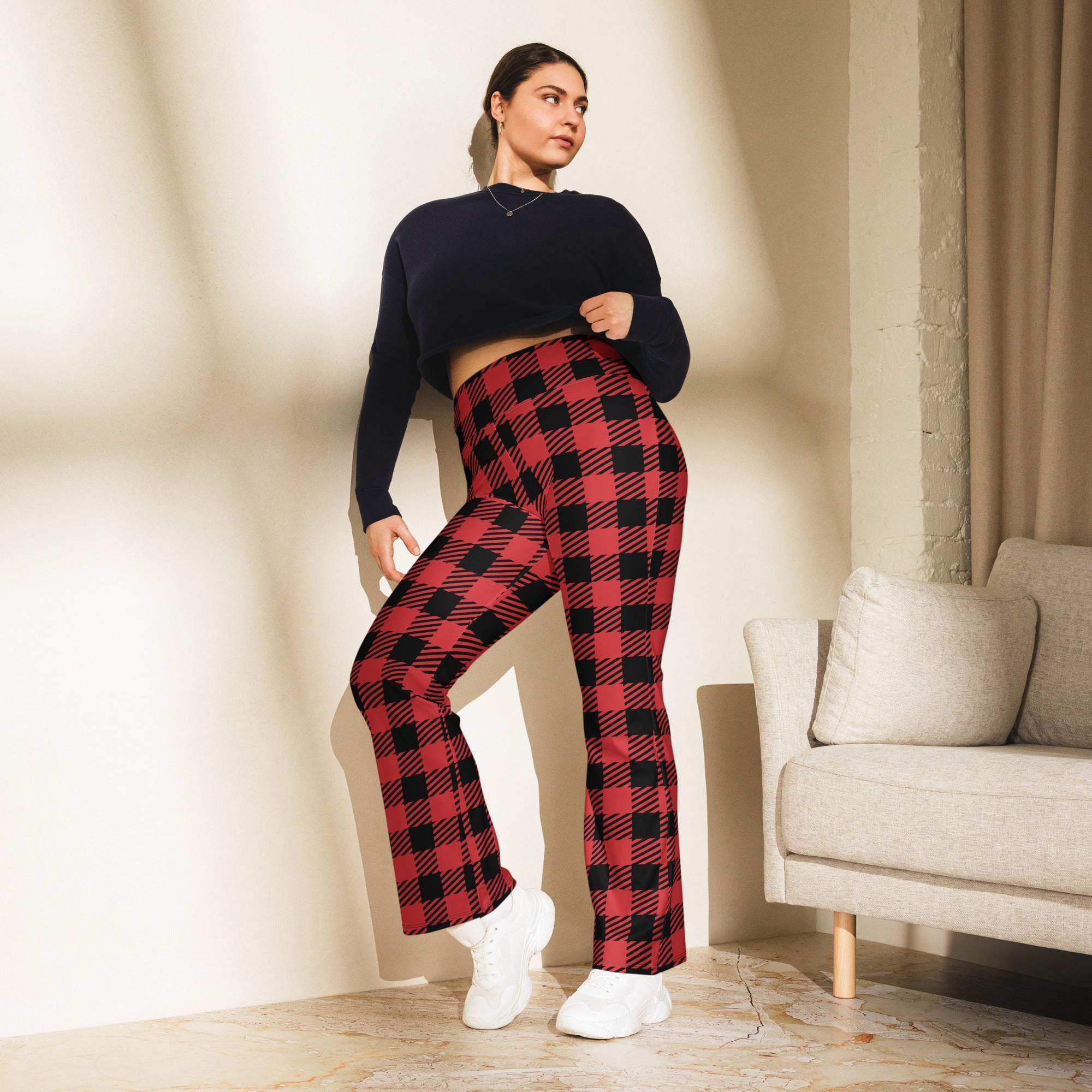 Women’s red buffalo plaid high waist flare legging pants featuring red and black plaid fabric and flared design