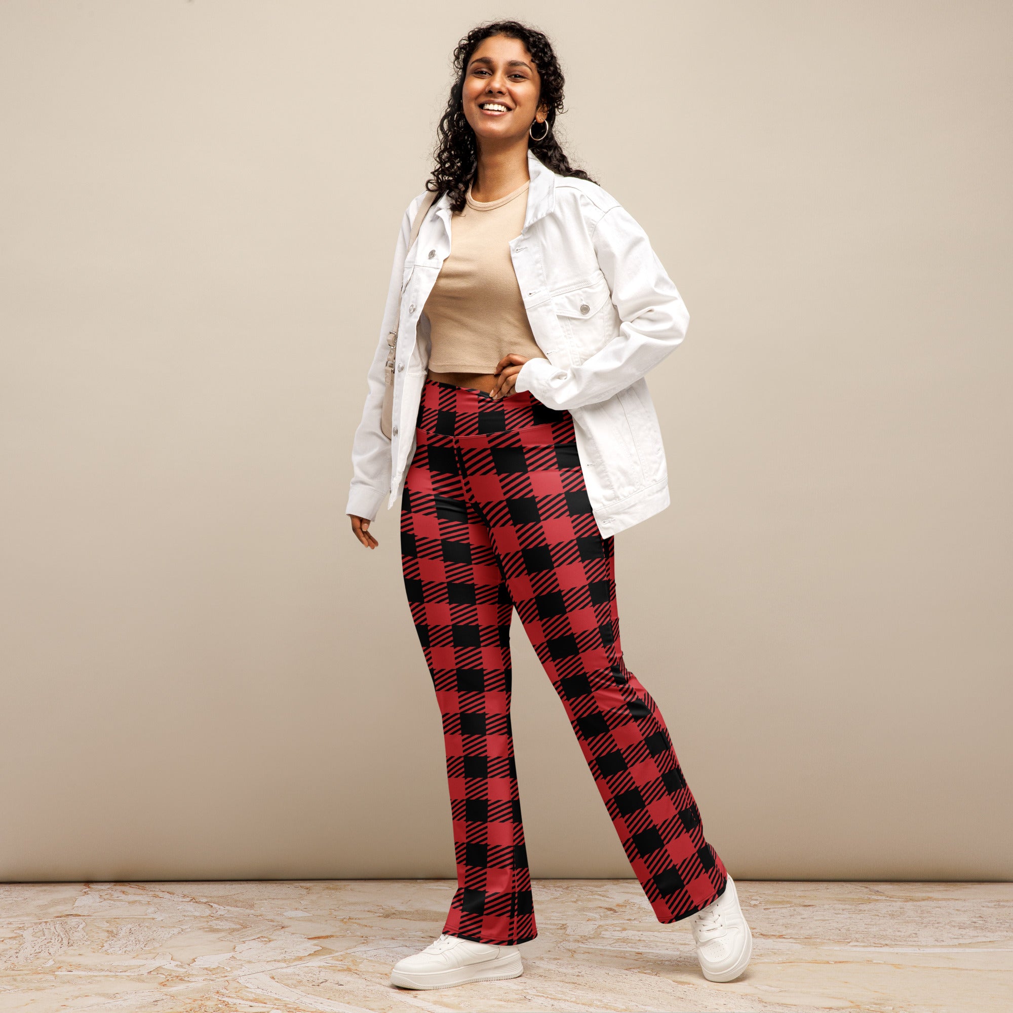 Women’s red buffalo plaid high waist flare legging pants in red and black plaid fabric front view