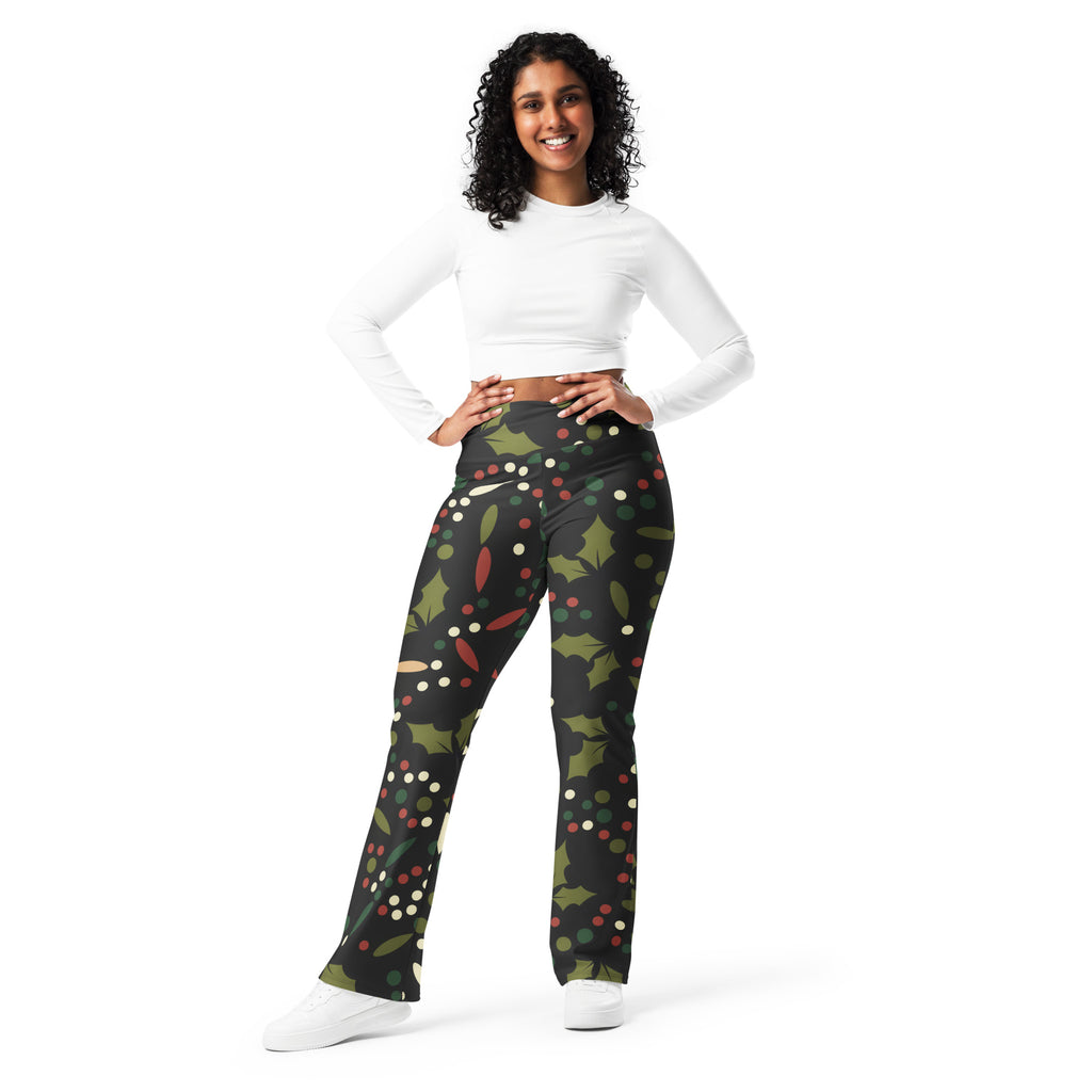 Women’s black high waist flare leggings with festive holly leaf red berry and white dot print for christmas