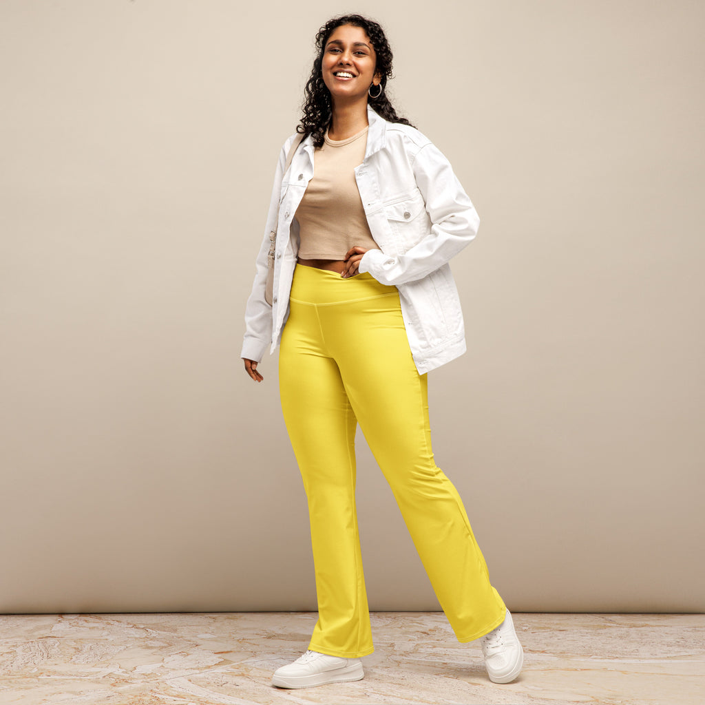 Women’s yellow high waist flare legging pants made of smooth stretchy fabric with bright yellow color