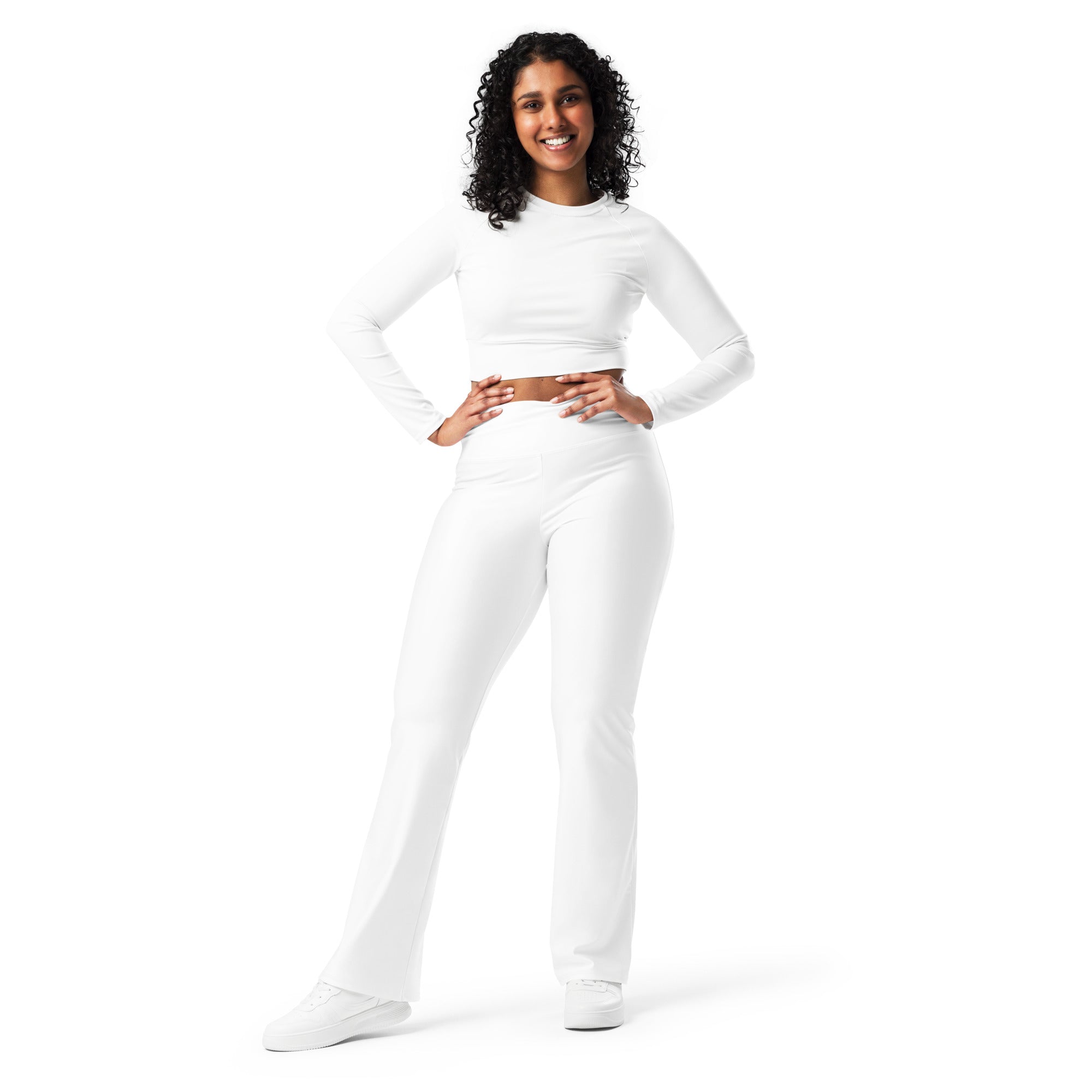 Women’s white high waist flare legging pants set featuring a long-sleeved crop top and matching flared pants