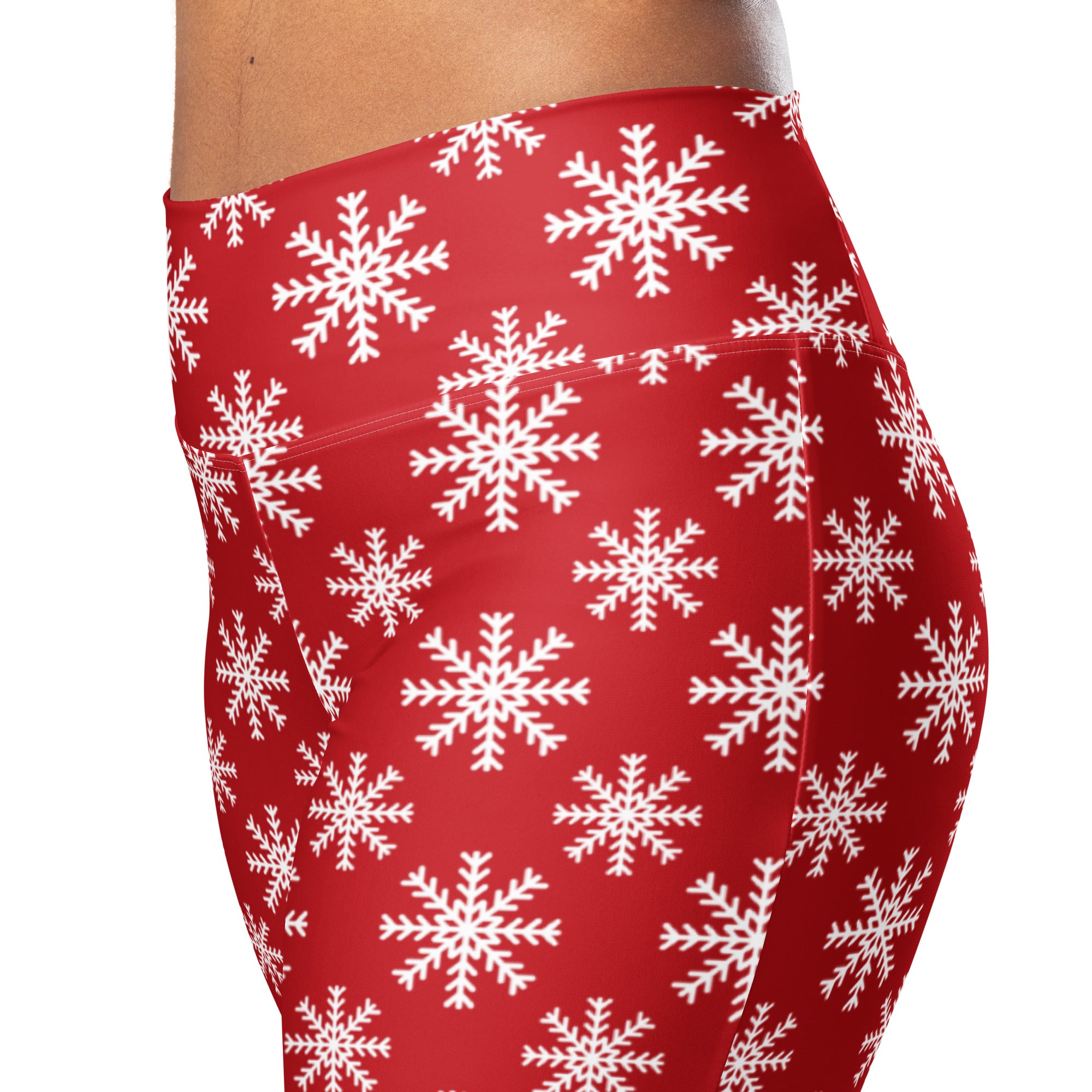 Women’s red high waist flare leggings with a repeating white snowflake pattern perfect for winter wear