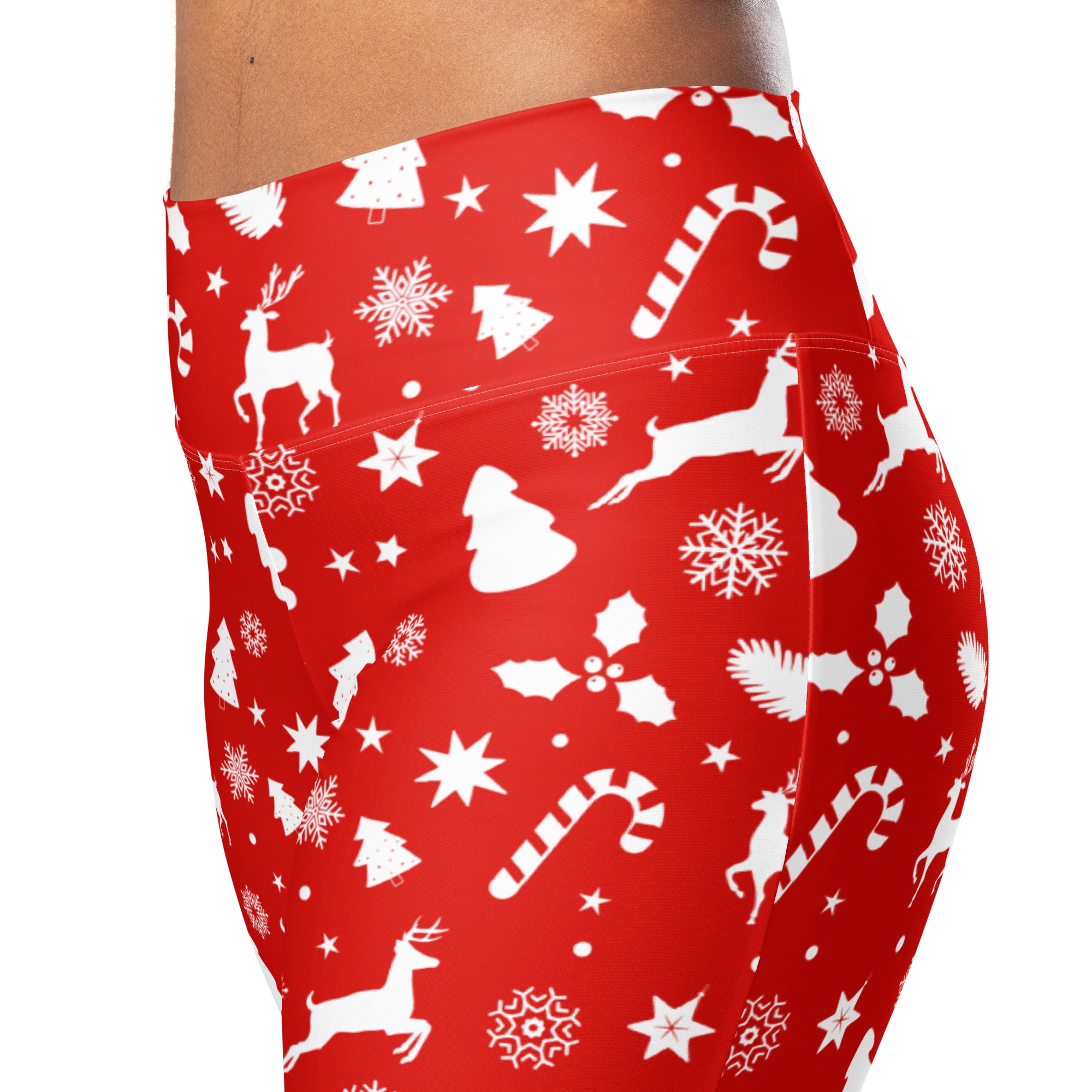 Women’s red christmas print high waist flare leggings with white reindeer candy cane snowflake and holly silhouettes