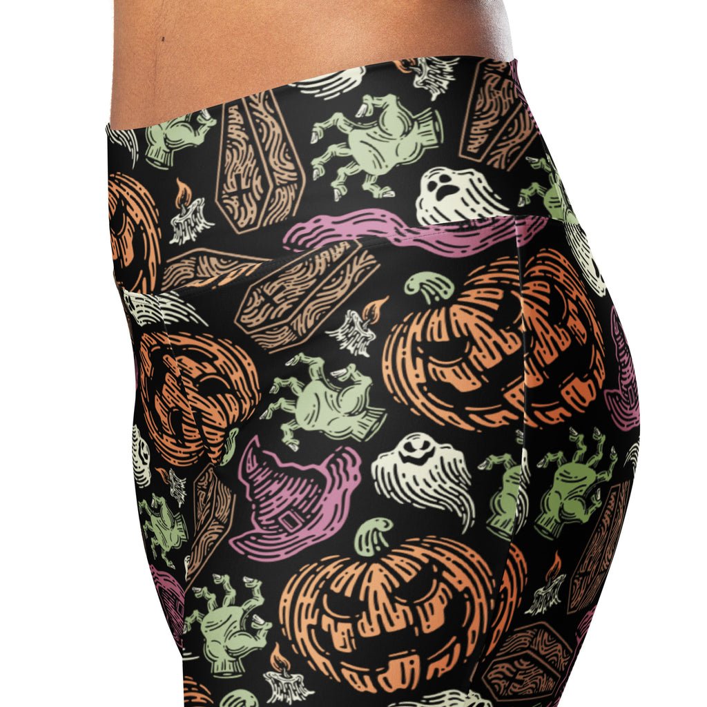 Women’s creepy halloween high waist flare leggings in black with orange pumpkins green ghosts purple witch hats and coffins pattern