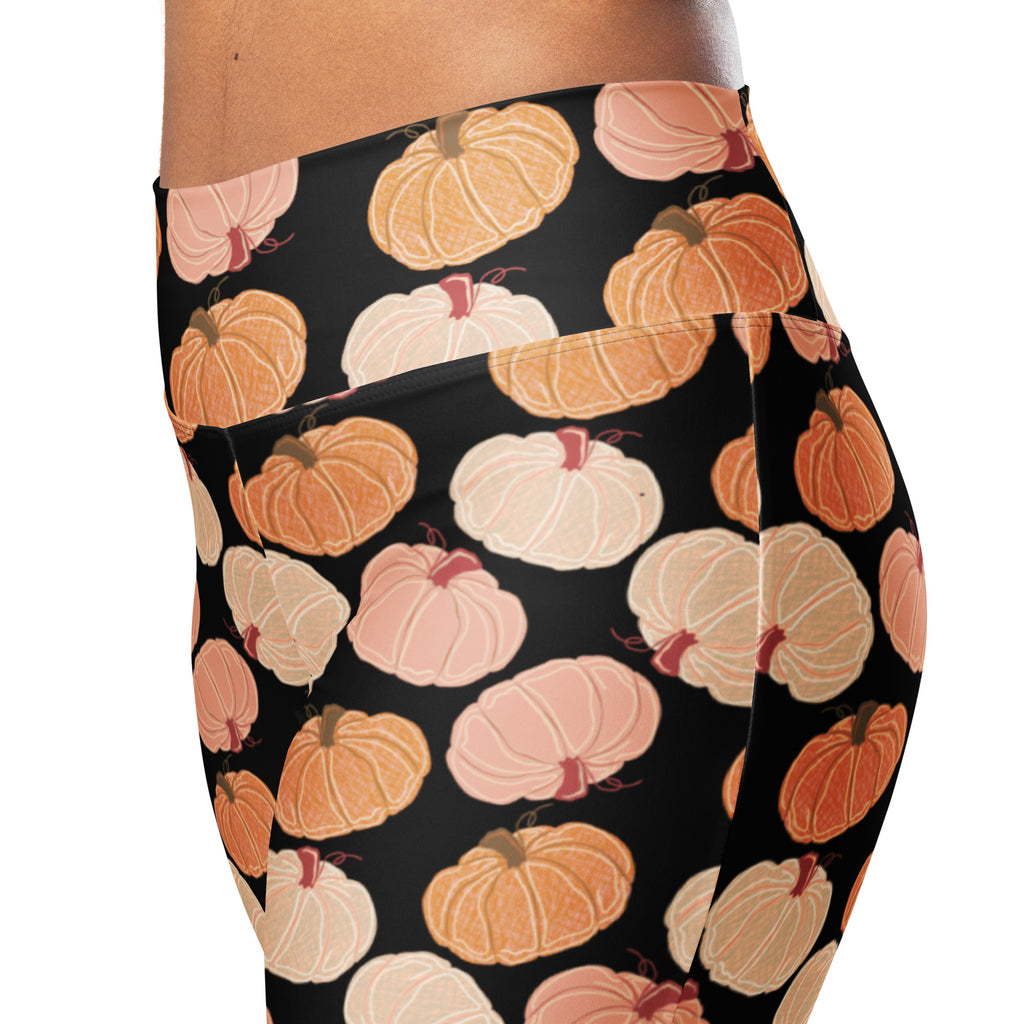 Women’s pumpkin patch high waist flare leggings in black with a playful orange peach and cream pumpkin pattern