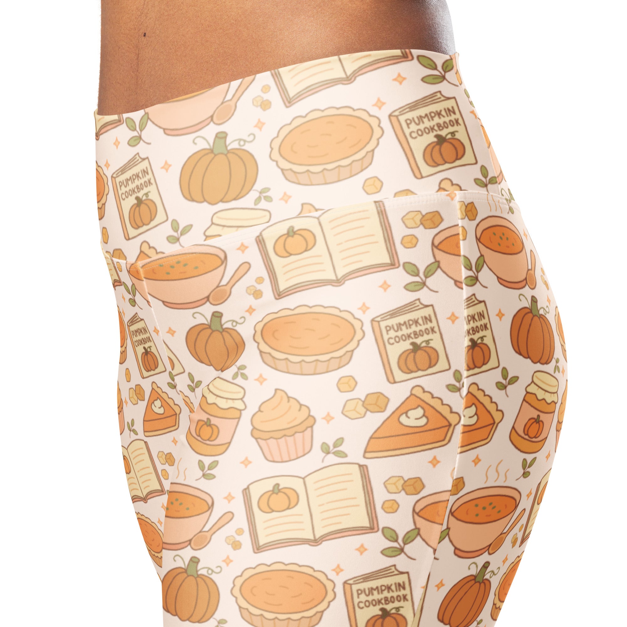 Women’s cream-colored high waist flare leggings with playful autumn pattern of pumpkins pumpkin pie and cookbooks