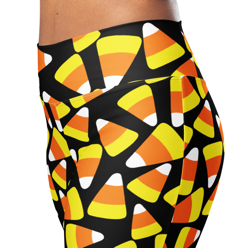 Women’s candy corn high waist flare leggings in black with vibrant orange yellow and white candy corn pattern