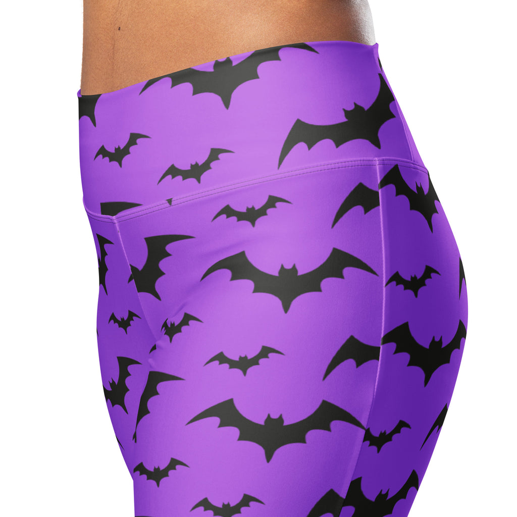 Purple high waist flare leggings with a bold black bat pattern perfect for women’s halloween wear