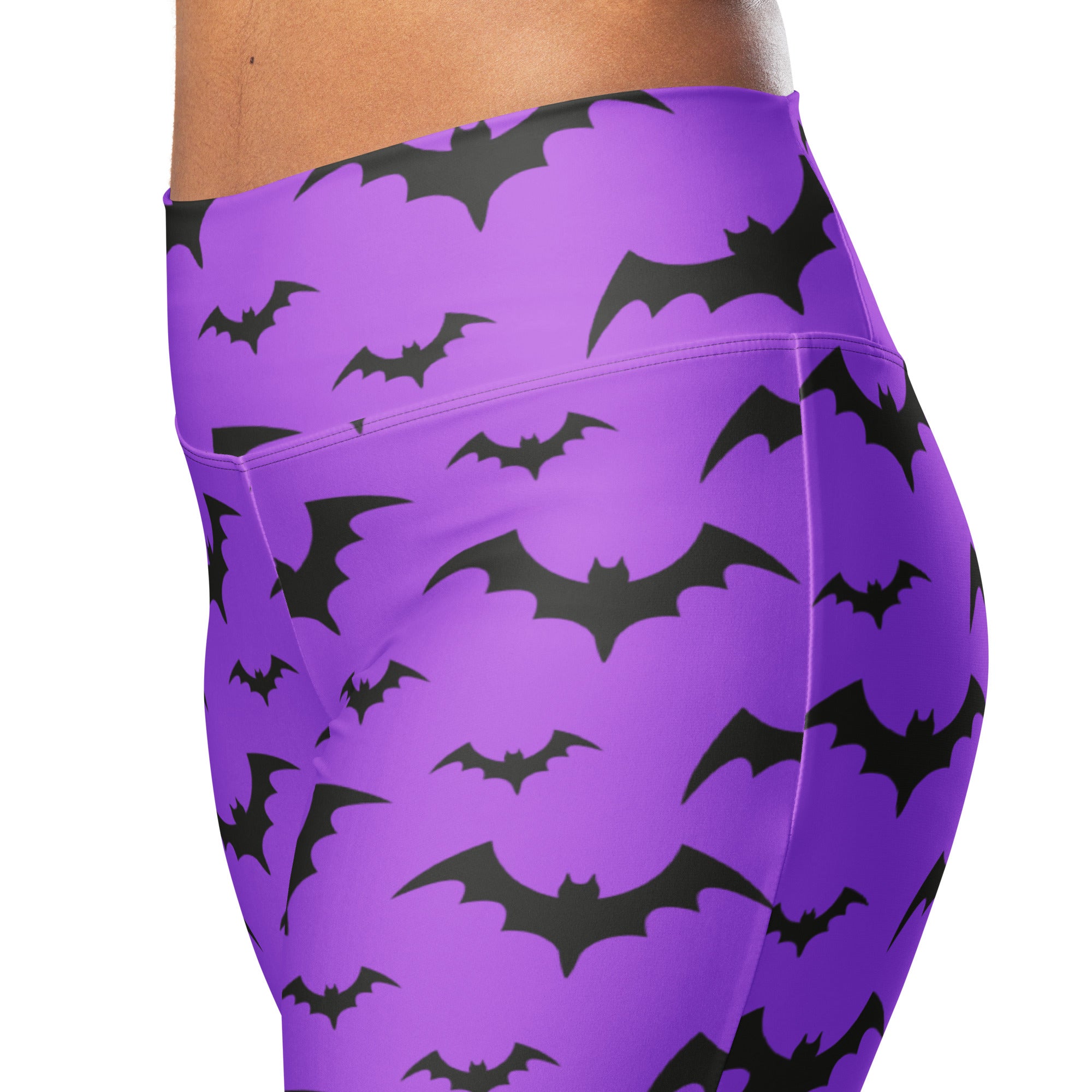 Purple high waist flare leggings with a bold black bat pattern perfect for women’s halloween wear