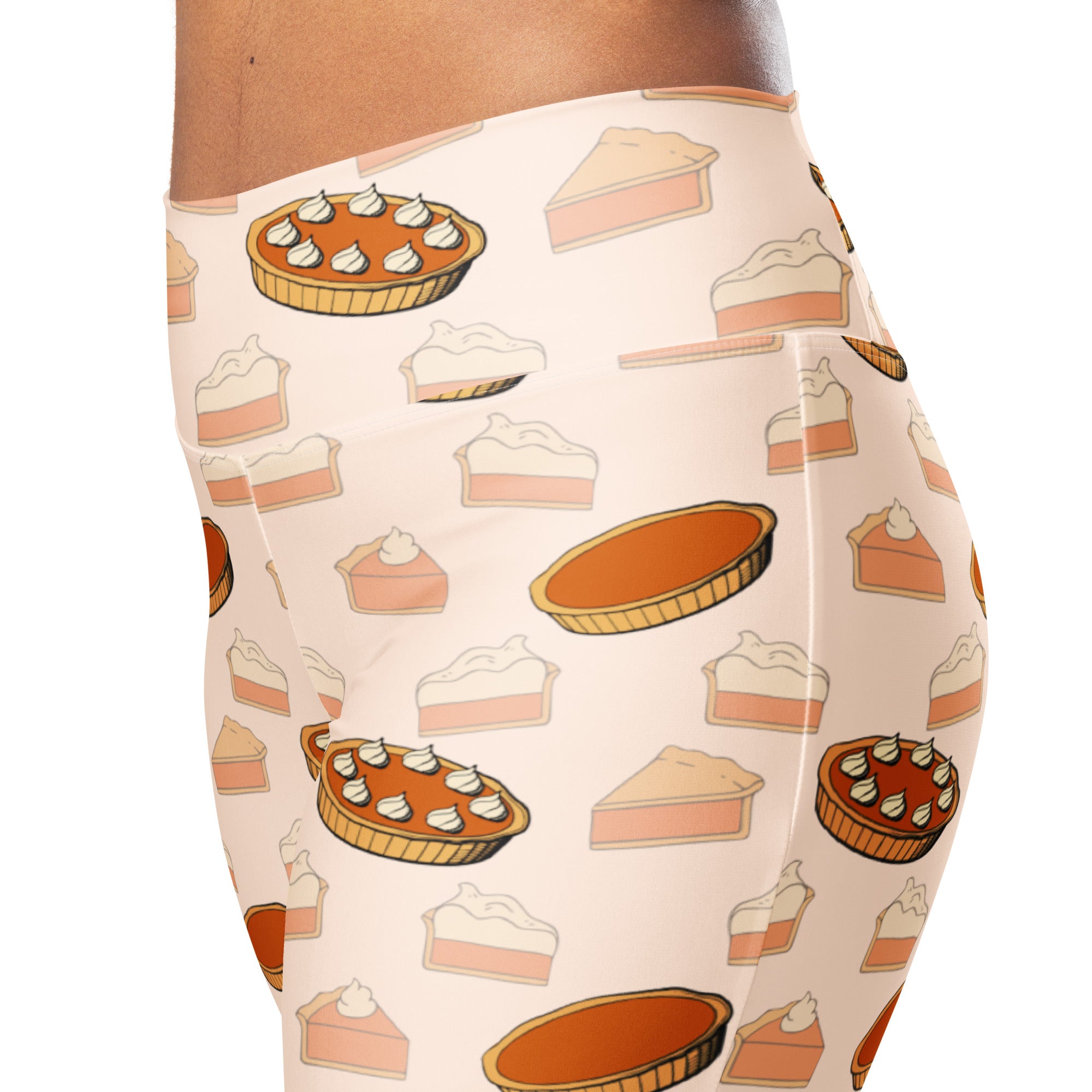 Women’s cream-colored high waist flare leggings with playful pumpkin pie pattern in warm orange beige and white tones