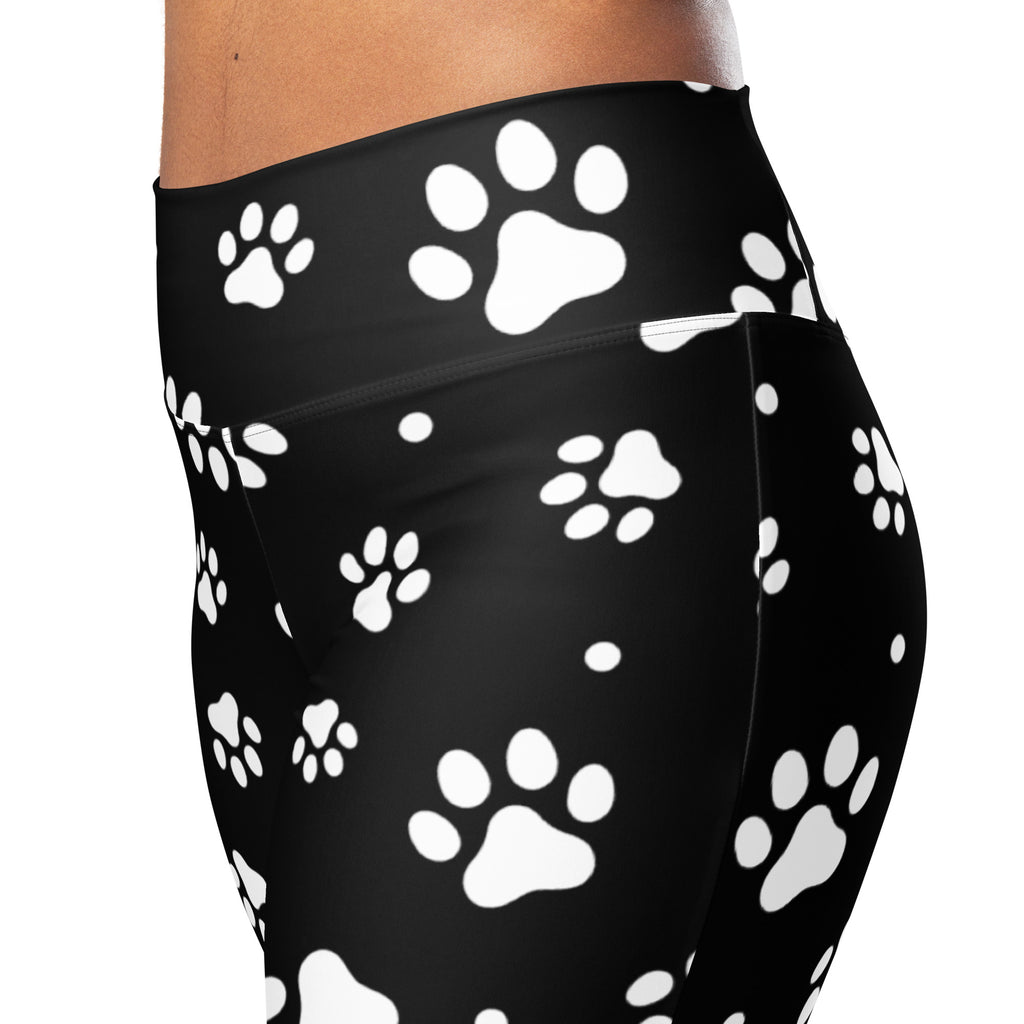 Women’s black high waist flare leggings with white paw print pattern perfect for casual wear
