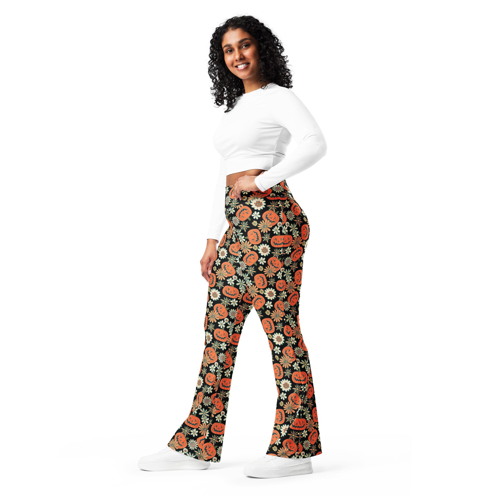 Women’s retro halloween high waist black flared pants with orange jack o lantern and white daisy pattern