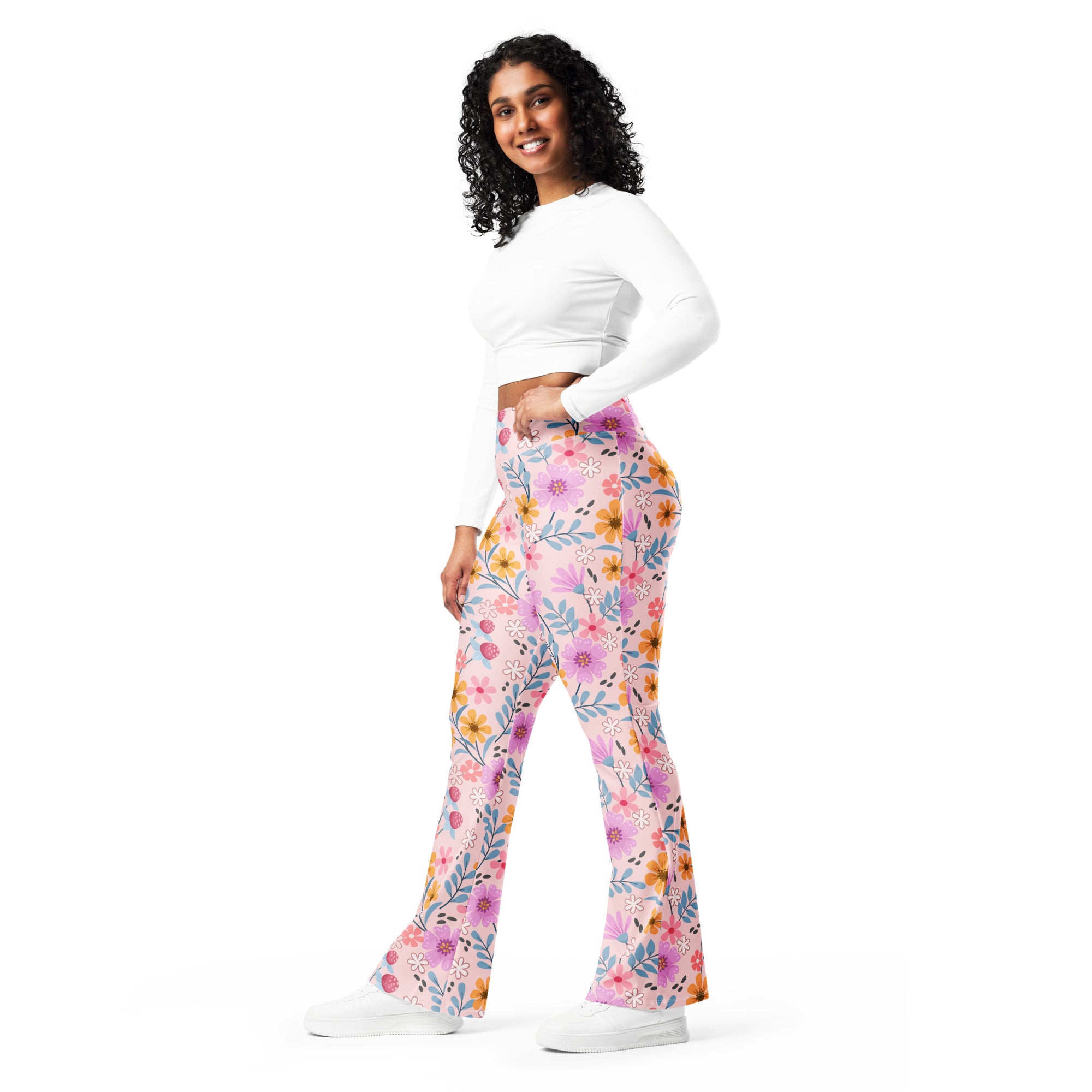 Women’s pink floral high waist flare legging pants with pastel and vibrant blossom patterns