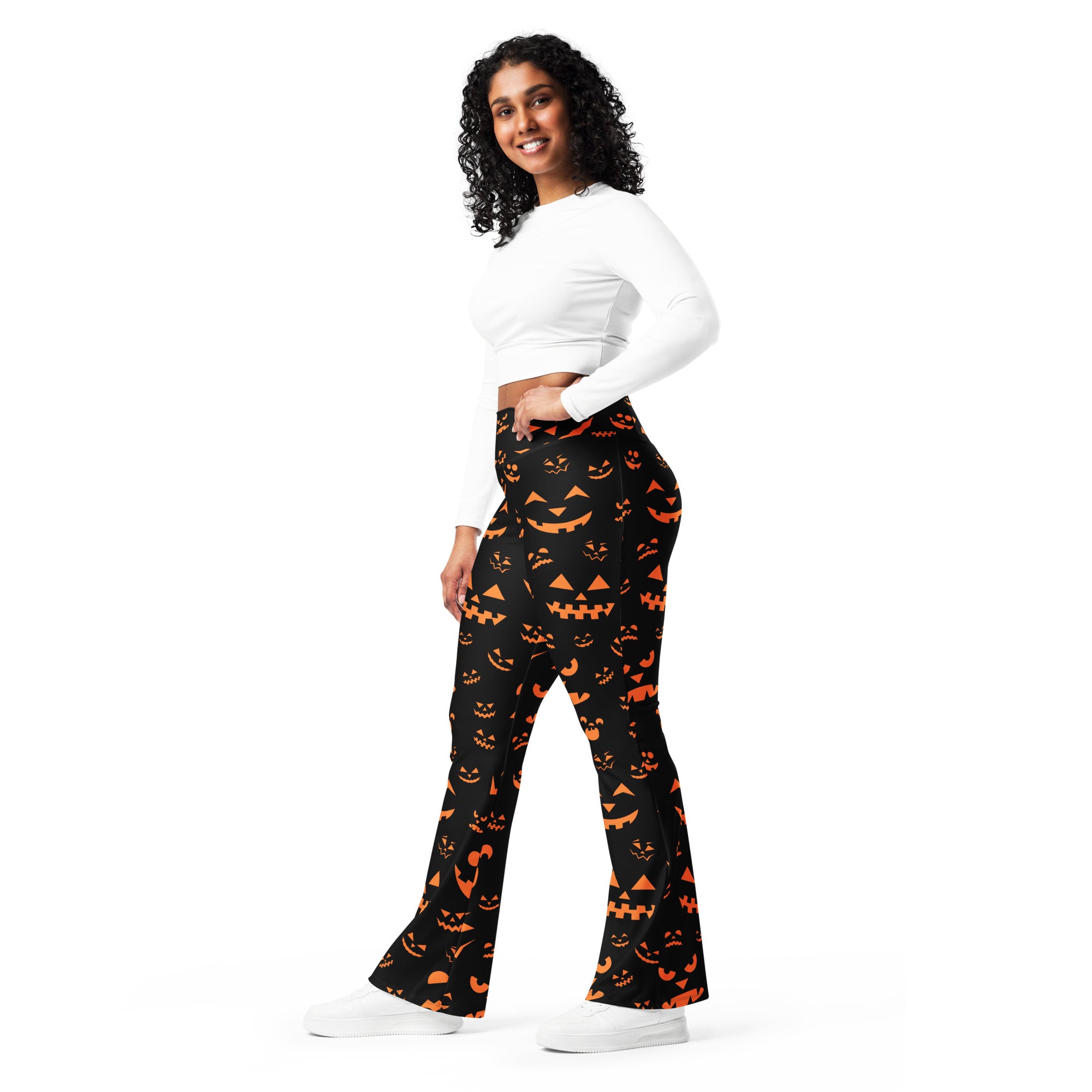 Women’s black flared pants with vibrant orange jack o lantern pattern high waist halloween leggings