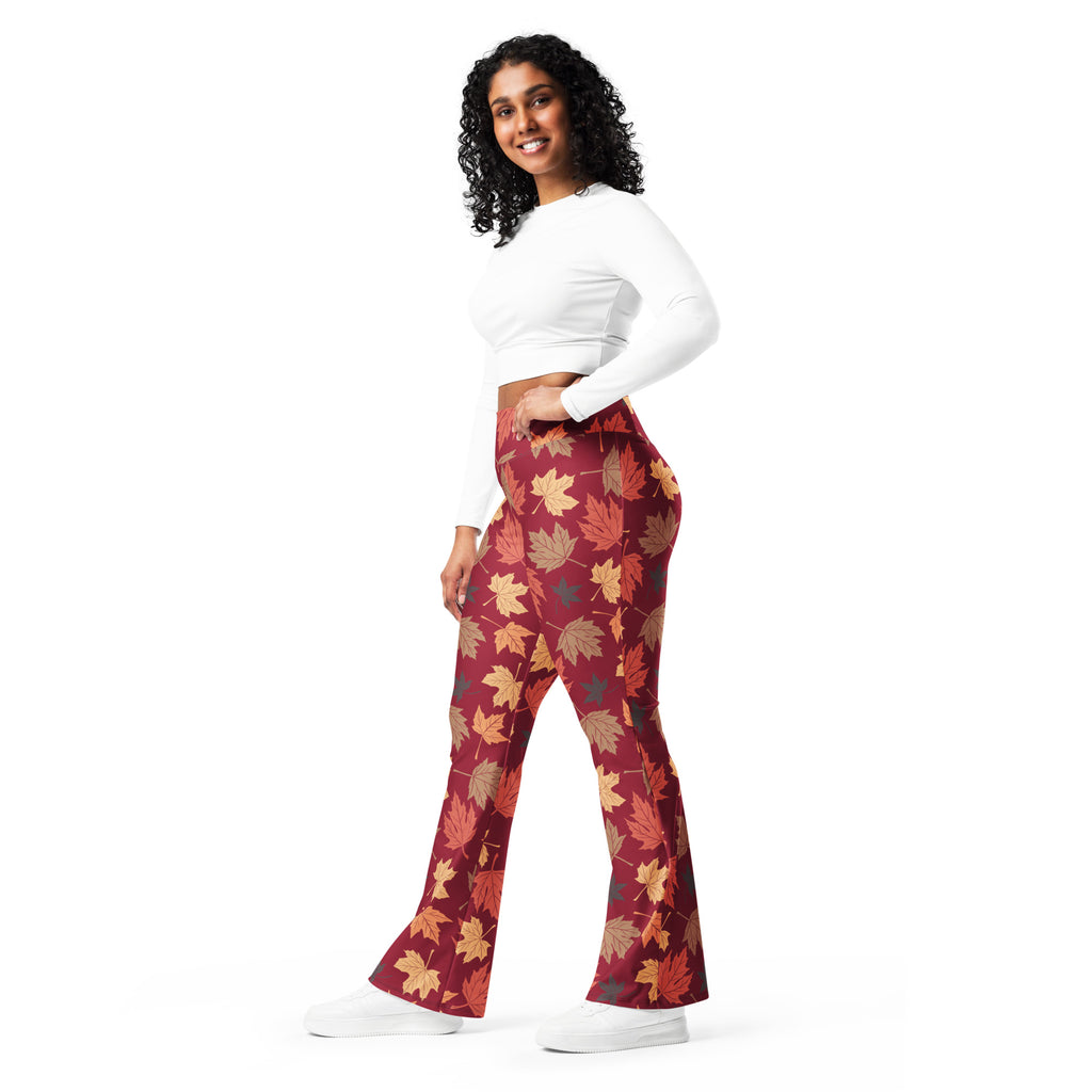 Women’s autumn leaves high waist flare legging pants in maroon fabric with vibrant orange yellow and brown leaf pattern
