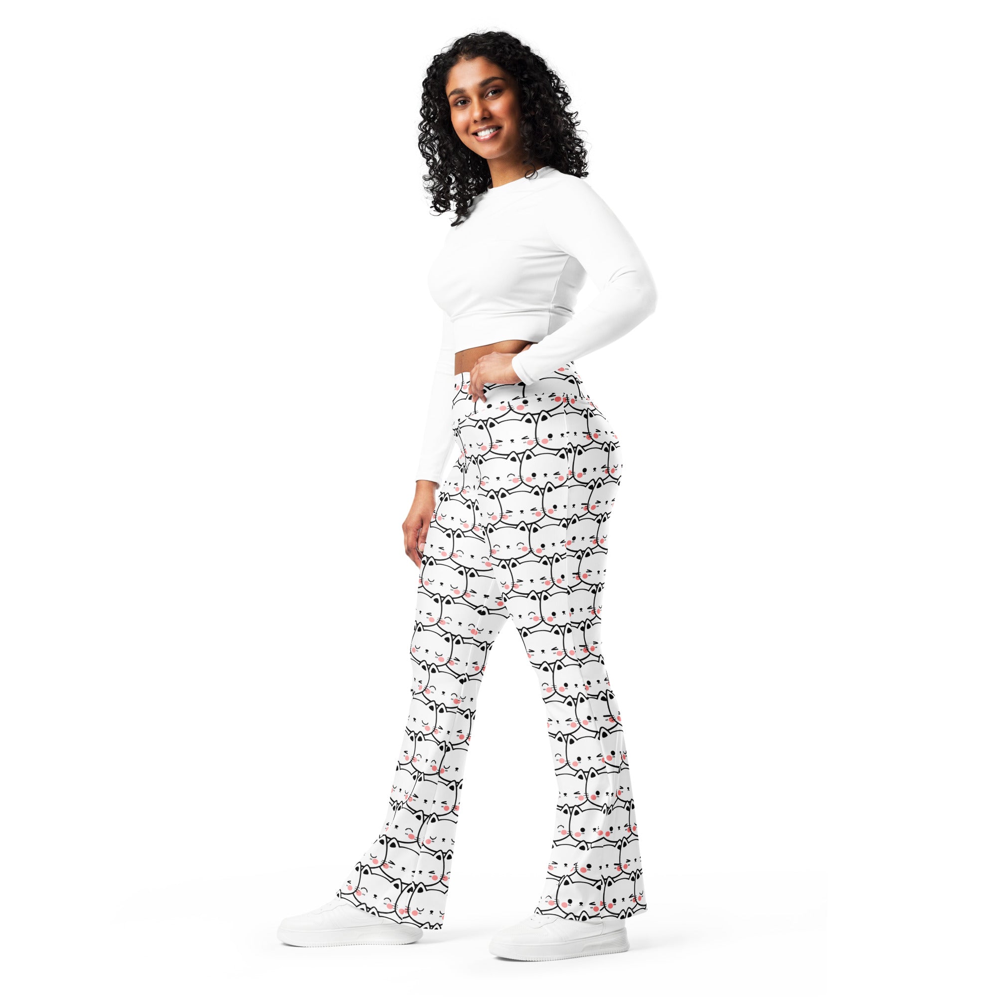 Women’s white cat print high waist flare legging pants with repeating cute cartoon cats in black and pink accents