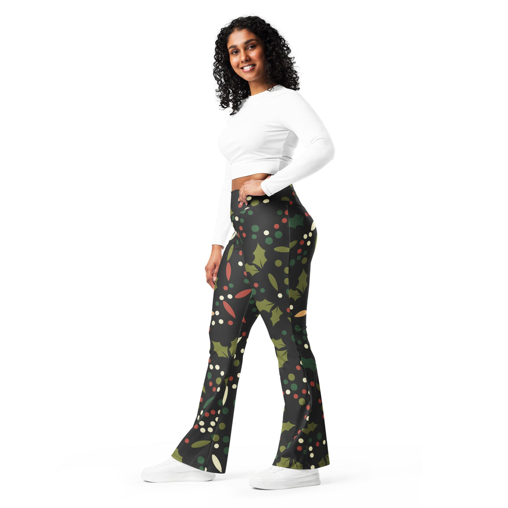 Women’s black flared pants with festive holly leaves red berries and multicolored polka dots high waist leggings