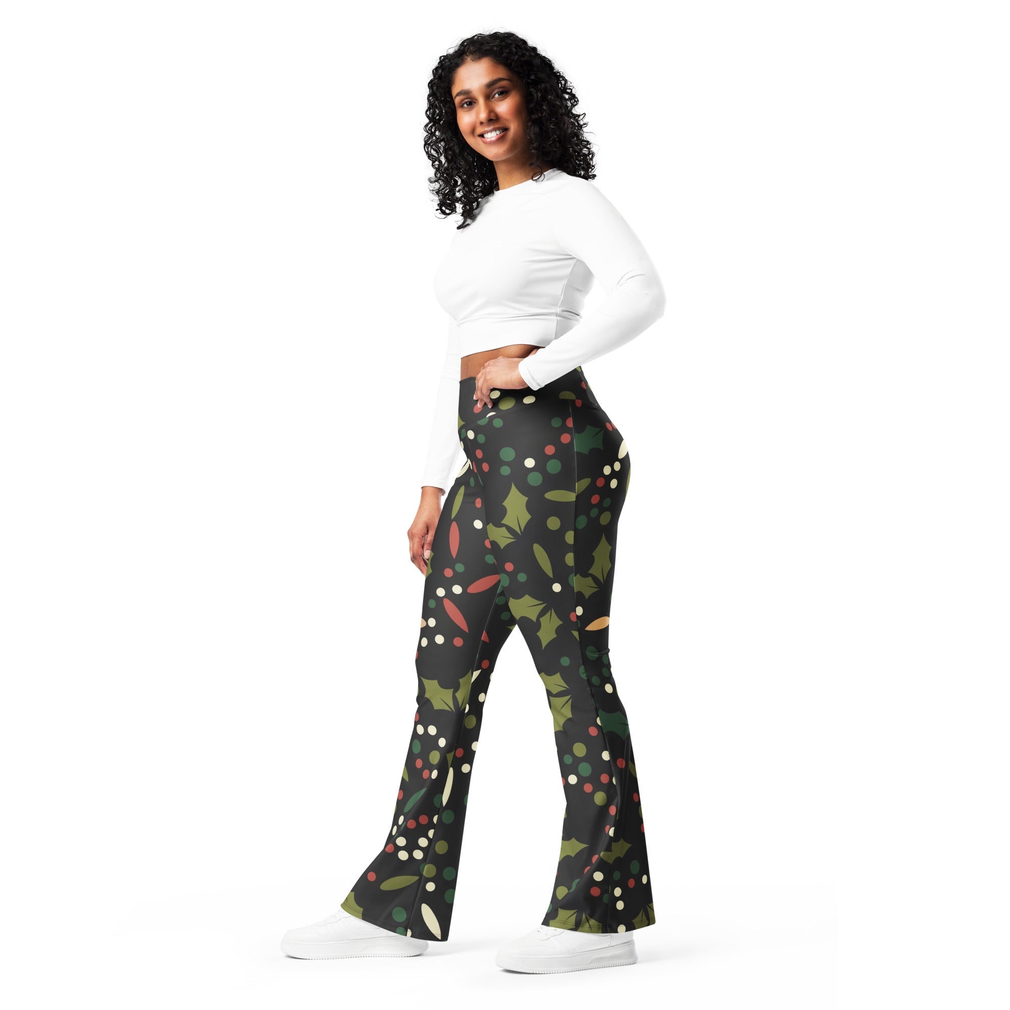 Women’s black flared pants with festive holly leaves red berries and multicolored polka dots high waist leggings