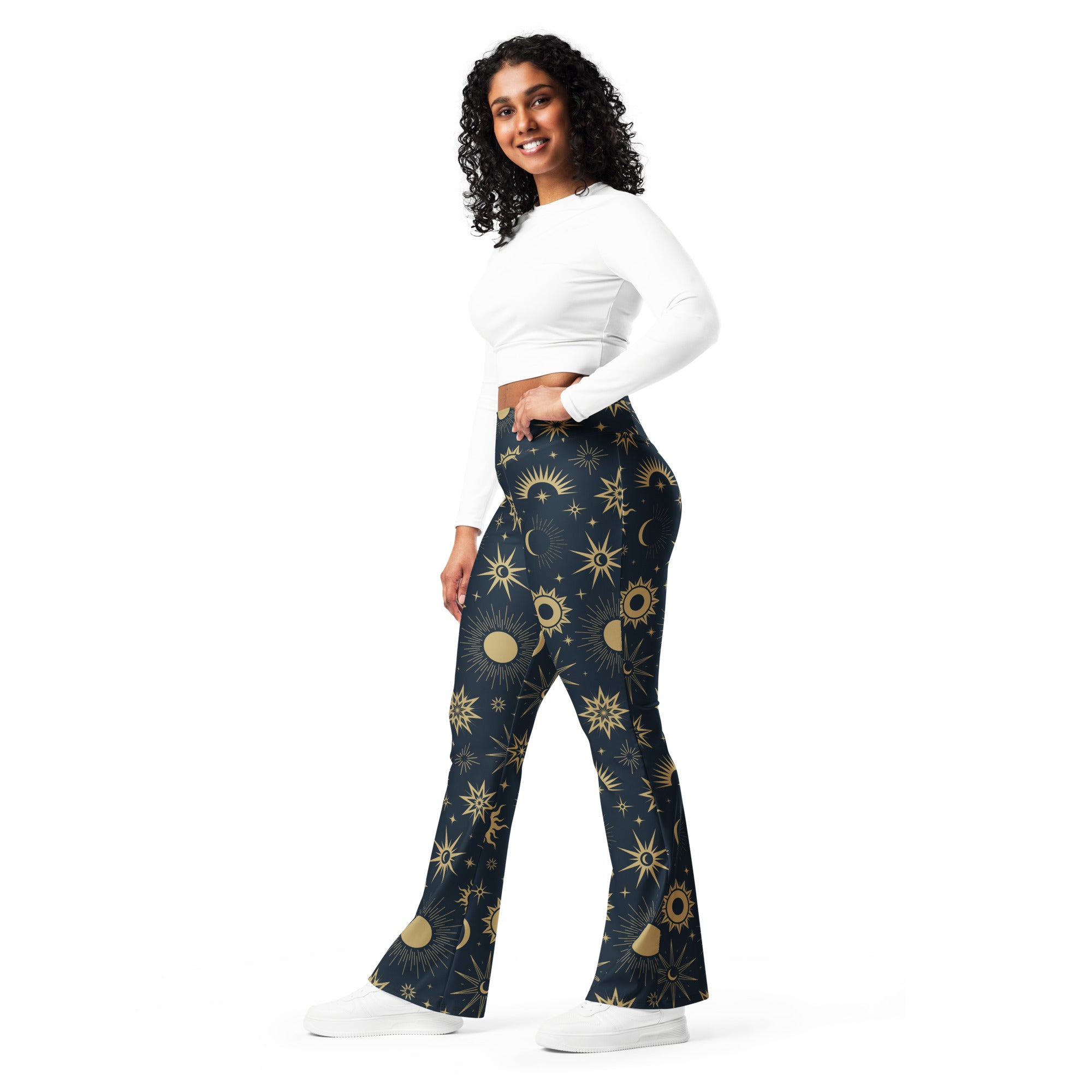 Women’s celestial sun and moon high waist flare pants in dark blue with vibrant gold celestial pattern