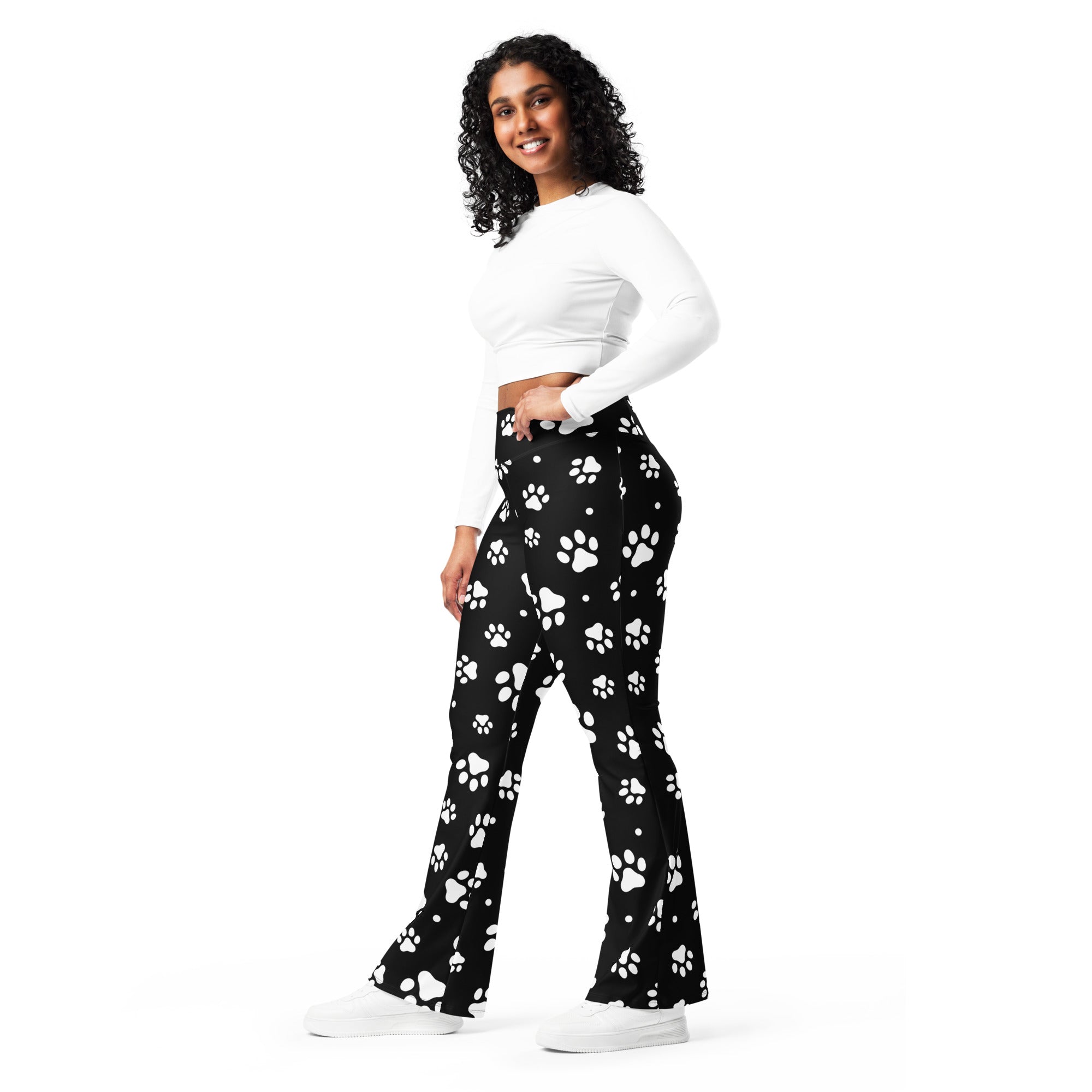 Women’s black high waist flare legging pants with playful white paw print pattern perfect for casual wear