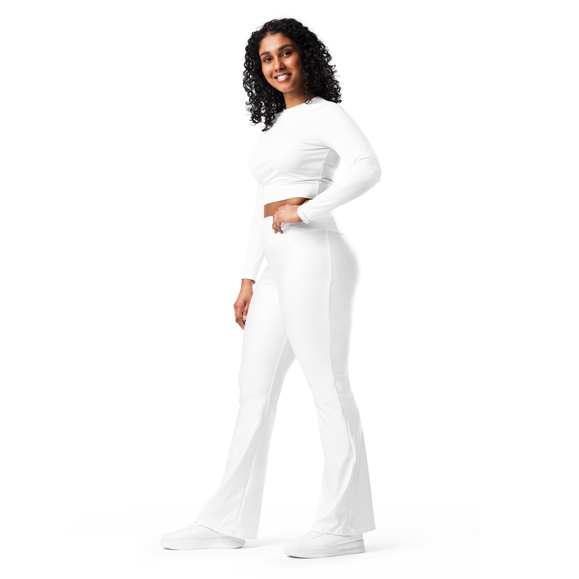 Women’s white high waist flare legging pants set featuring a long-sleeved crop top and matching flared pants
