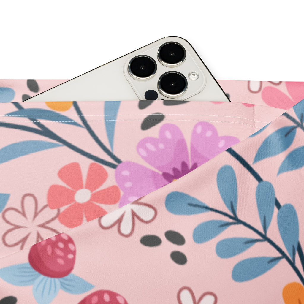 Women’s pink floral high waist flare legging pants with a playful strawberry and flower patterned phone pouch