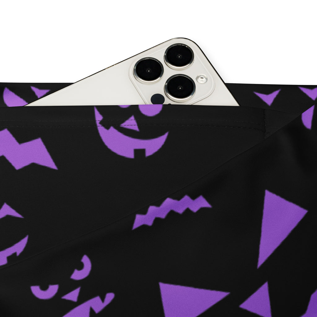Black fabric pouch with purple halloween jack-o’-lantern faces and geometric shapes for festive storage