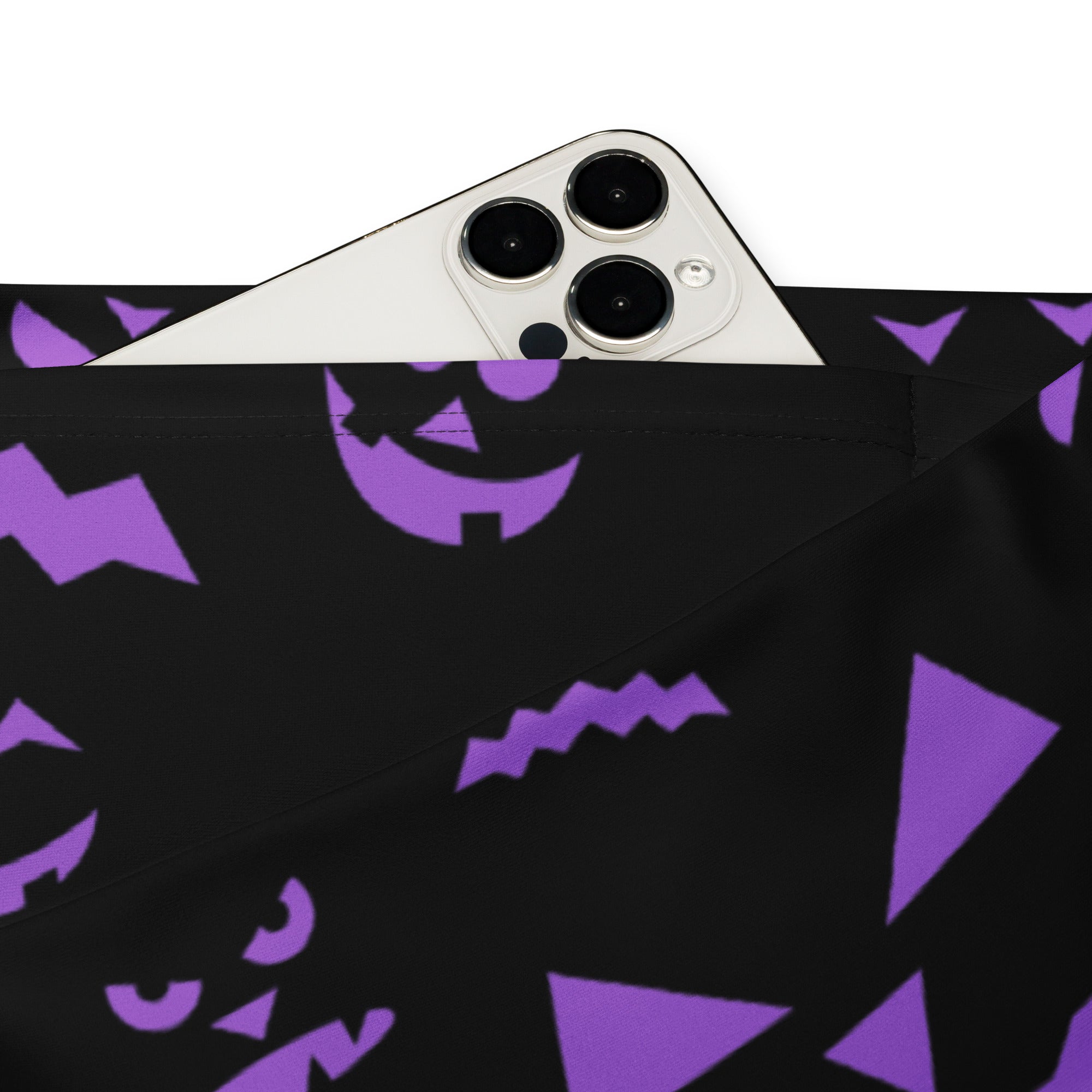 Black fabric pouch with purple halloween jack-o’-lantern faces and geometric shapes for festive storage