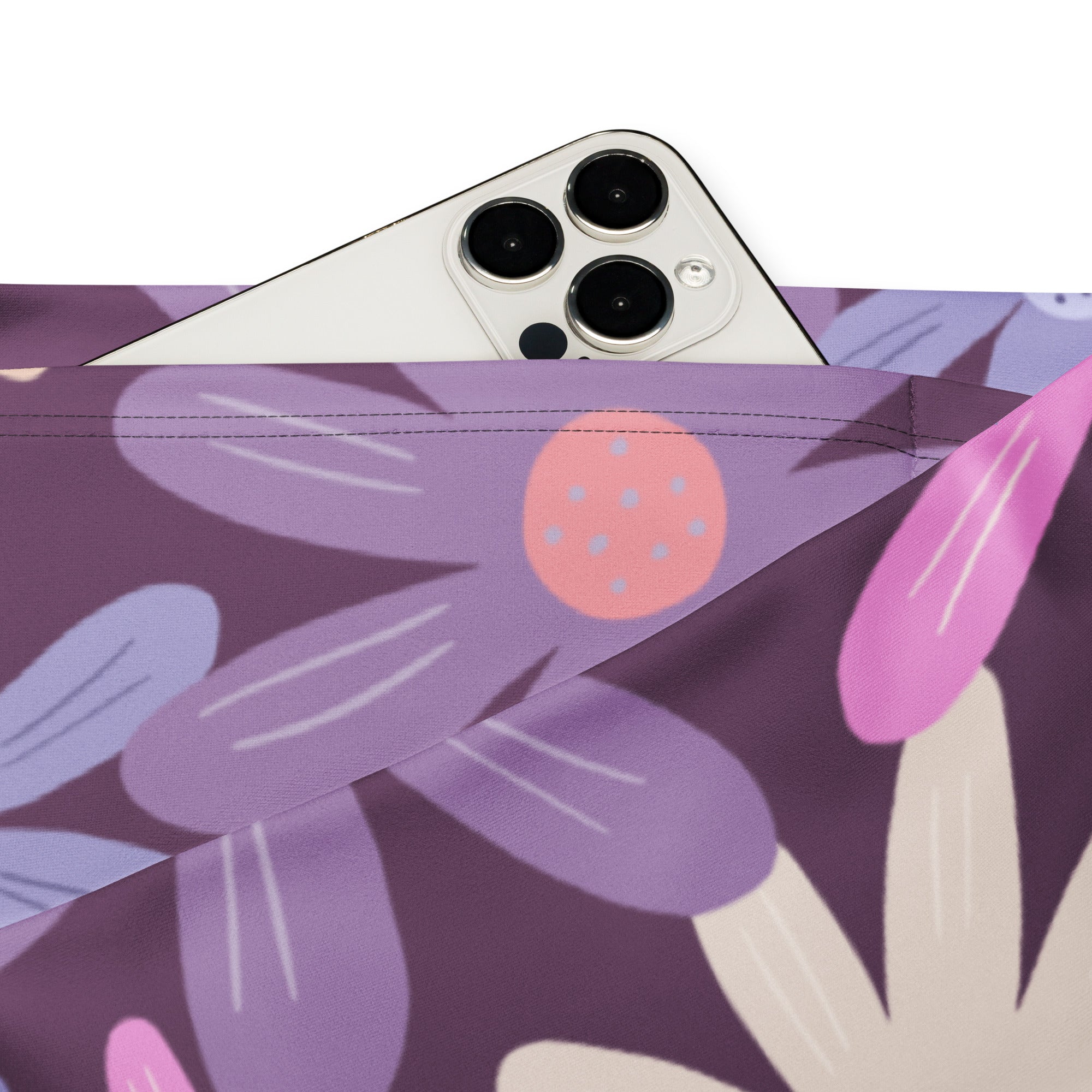 Purple floral-patterned phone pouch with pastel pink and lavender blossoms paired with women’s retro purple daisy high waist flare legging pants