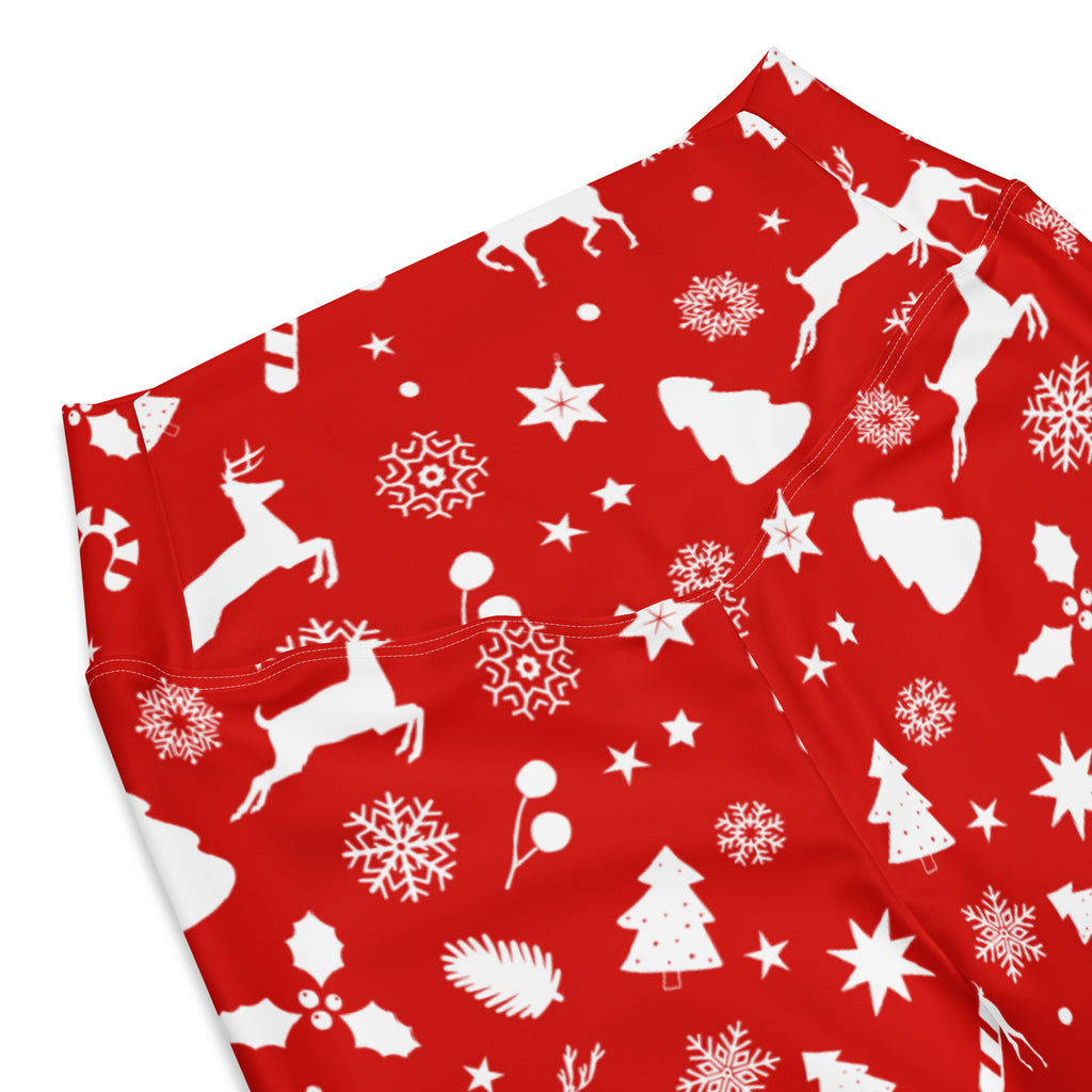 Women’s red high waist flare leggings with white Christmas prints of reindeer snowflakes stars holly and candy canes