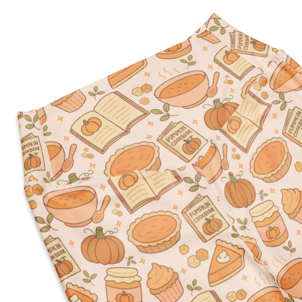 Women’s cream-colored high waist flare leggings with playful autumn pumpkin pie pattern of pumpkins pies and cookbooks